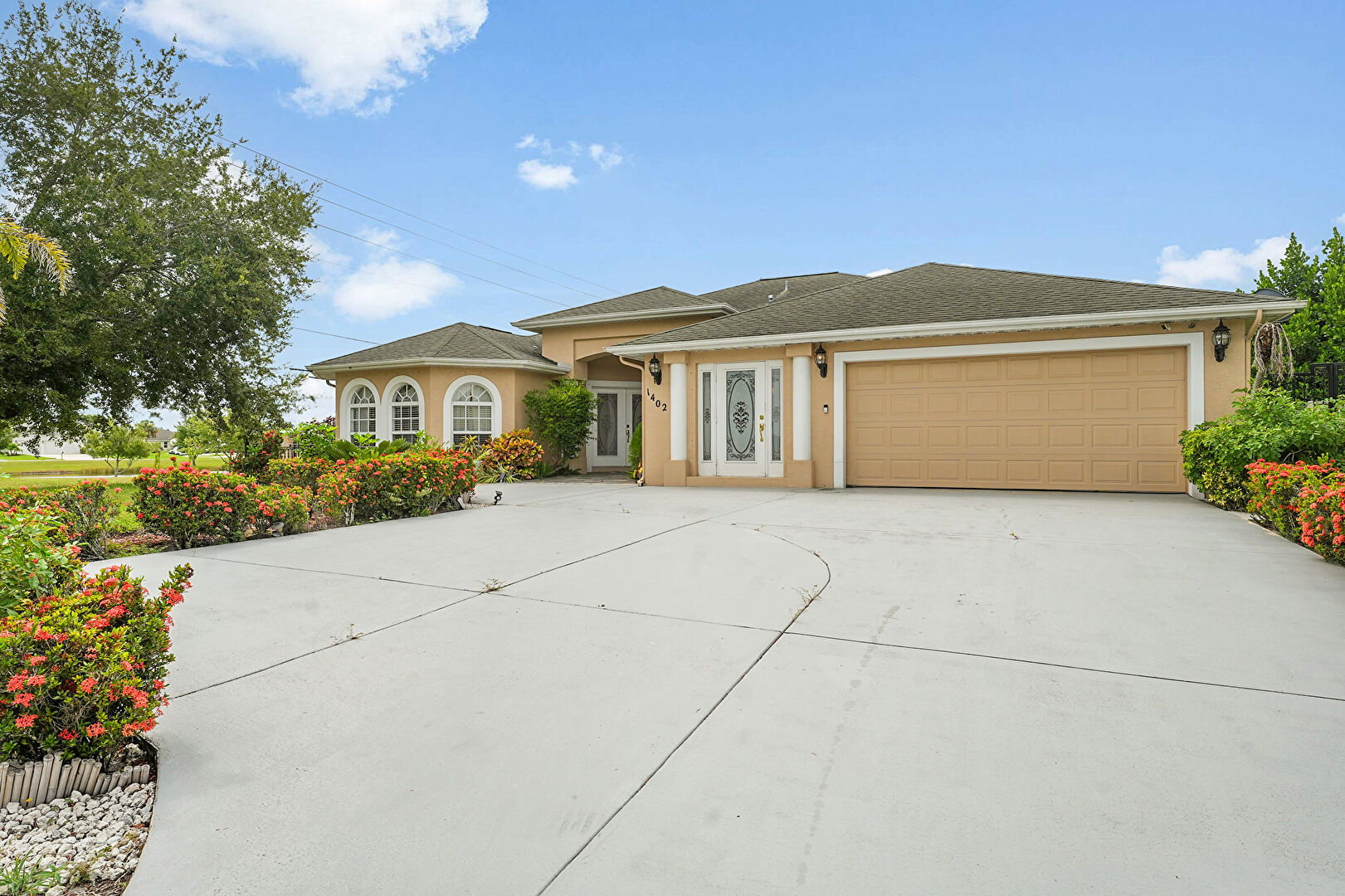 Front at 1402 Southwest Doe Court, Port St. Lucie, FL 34953, listed by Rhea Dunn