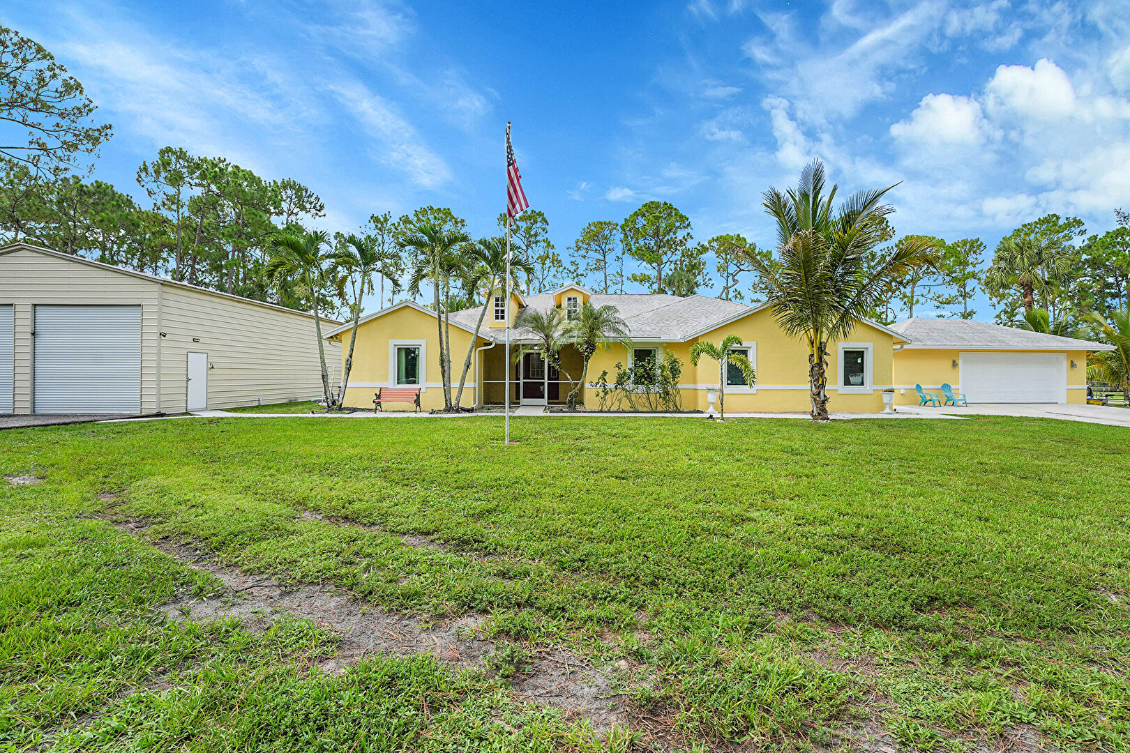 Front at 17646 83rd Place North, The Acreage, FL 33470, listed by Everil Calcagno