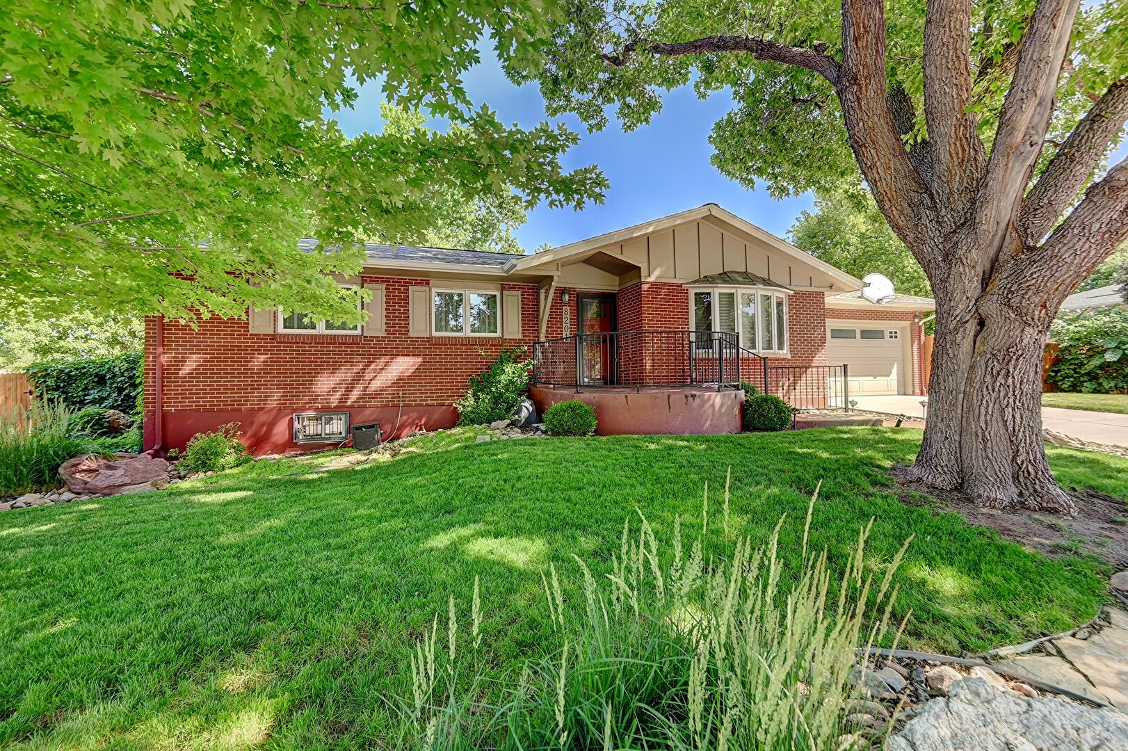 Front at 8201 East Lehigh Drive, Denver, CO 80237, listed by Carolyn Chandler