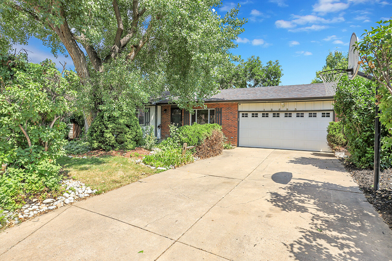 Front at 12593 West Grand Drive, Morrison, CO 80465, listed by Eric Carlton
