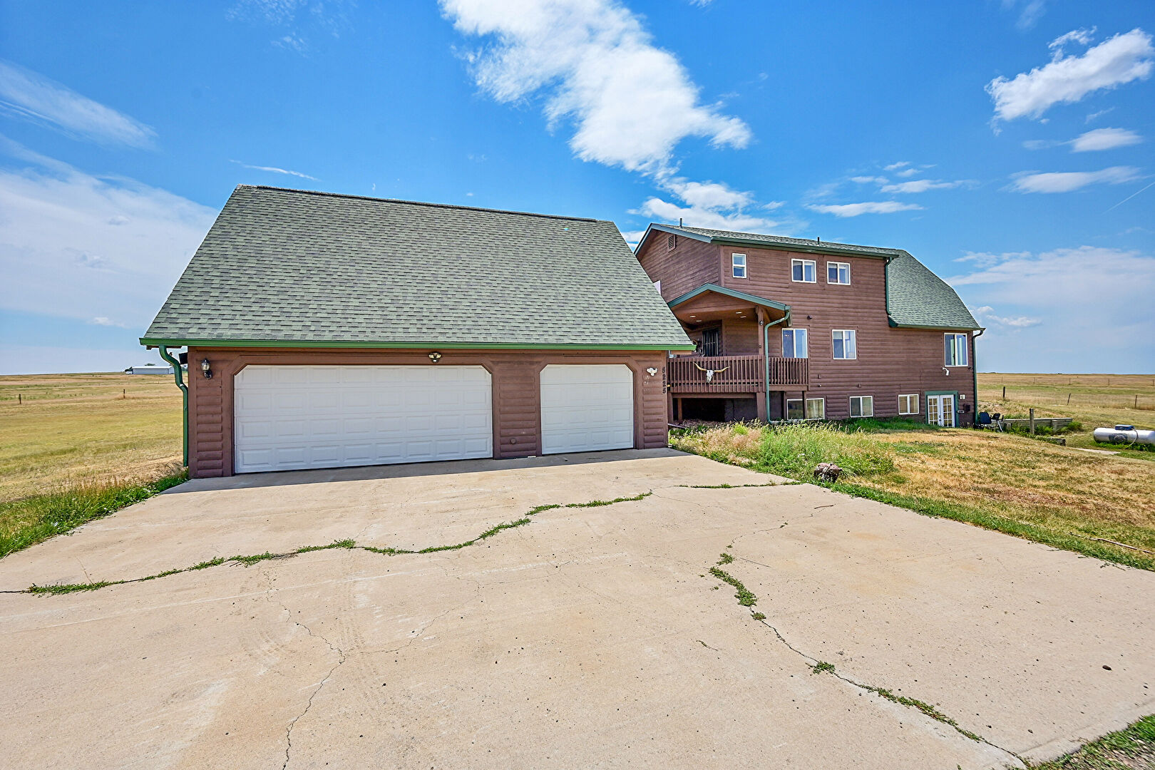 Front at 5225 Tom Bay Place, Bennett, CO 80102, listed by Cynthia Padilla