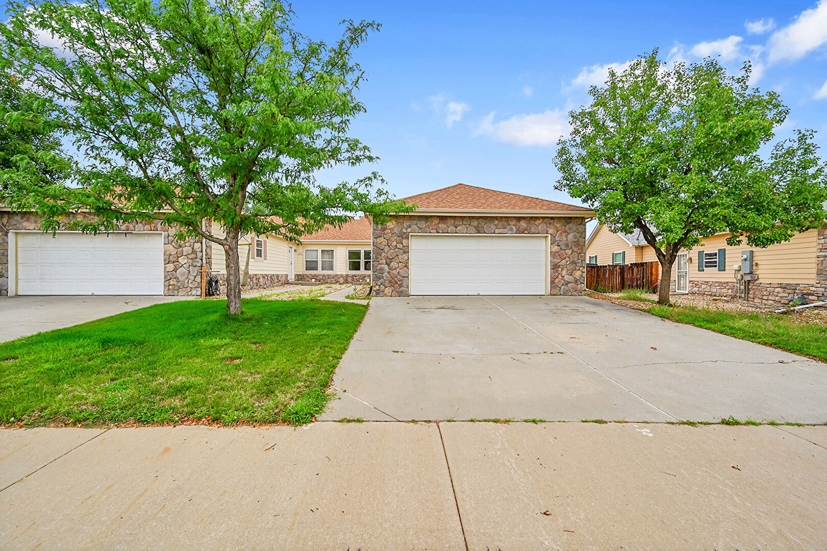 Front at 2493 Carriage Drive, Milliken, CO 80543, listed by Debra Graves