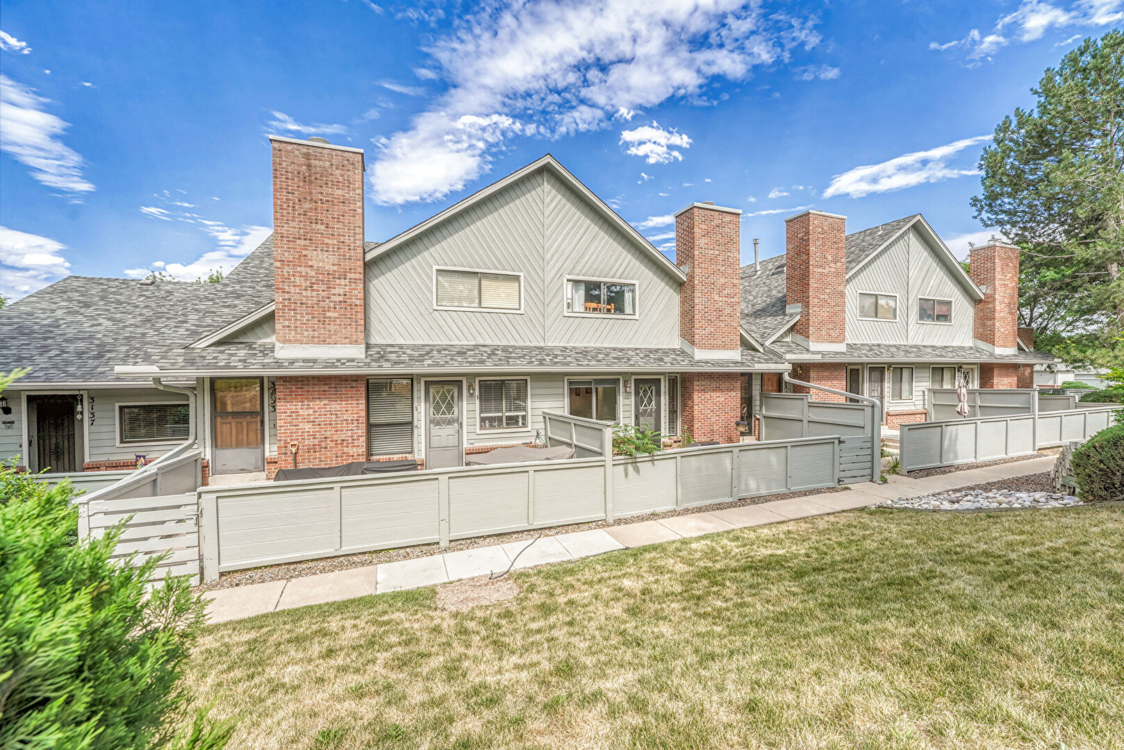 Front at 3127 East Long Circle South, Centennial, CO 80122, listed by Jennifer Arvizu