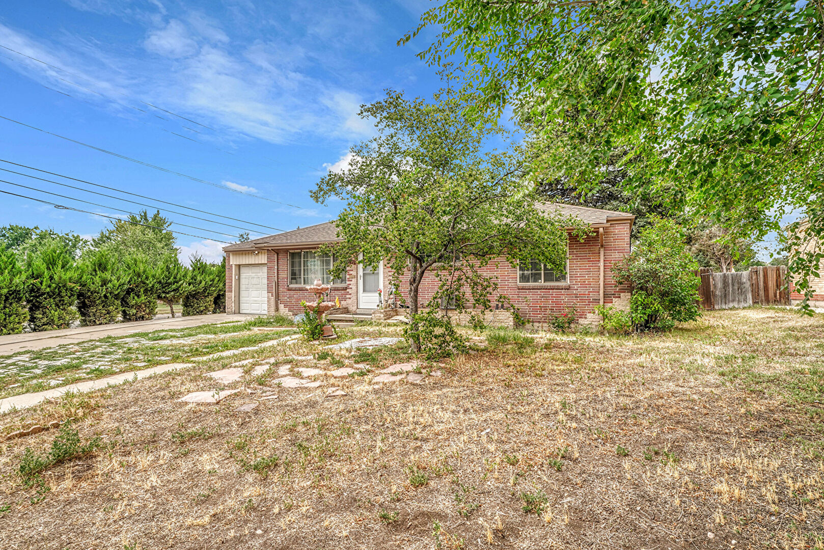 Front at 1493 South Yates Street, Denver, CO 80232, listed by Hang Le