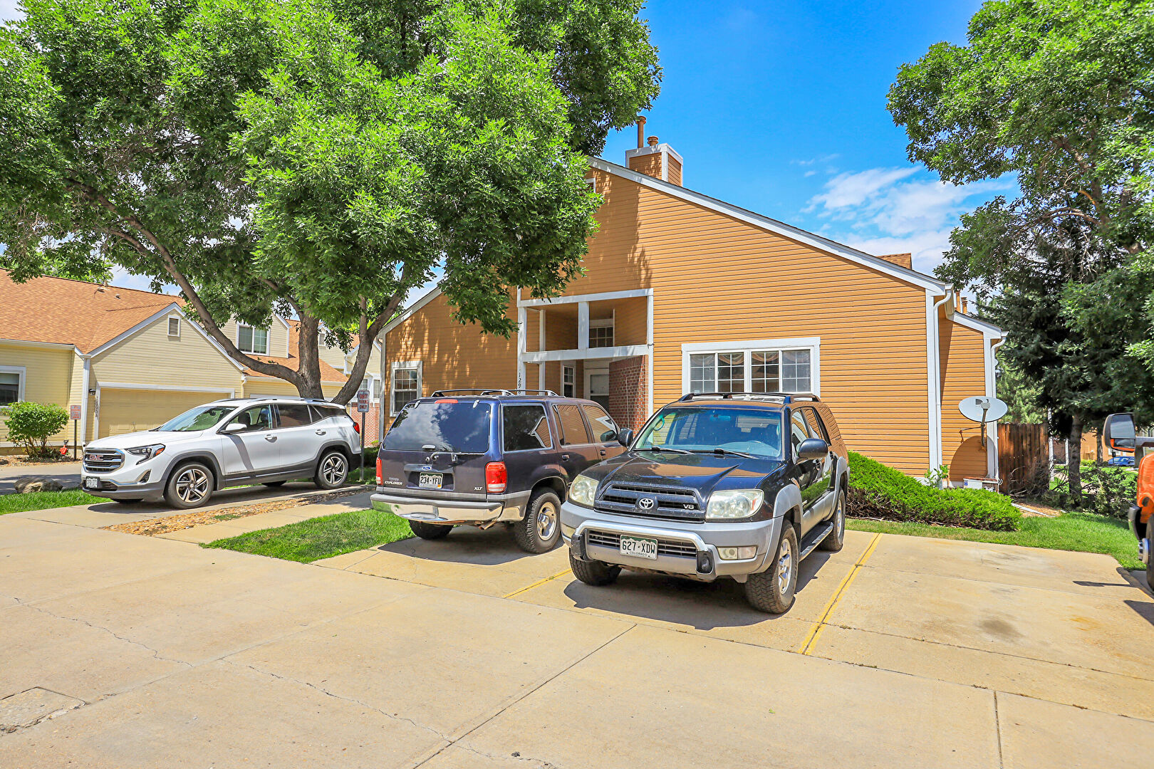 Front at 12985 West 64th Drive, D, Arvada, CO 80004, listed by Tim Hoyman