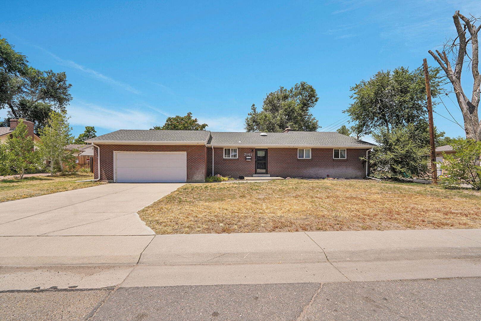 Front at 7141 Cherry Street, Commerce City, CO 80022, listed by Larina McClain