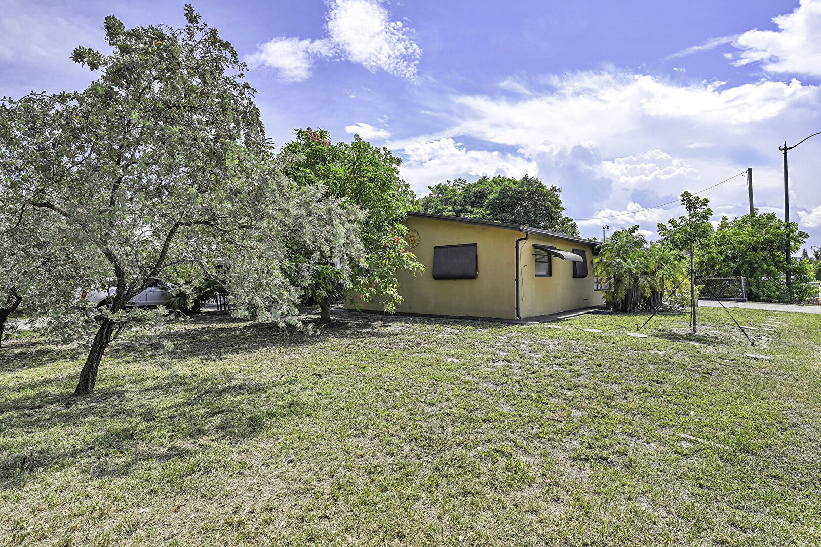 Yard at 1390 Northeast 39th Street, Pompano Beach, FL 33064, listed by Laura Sanders