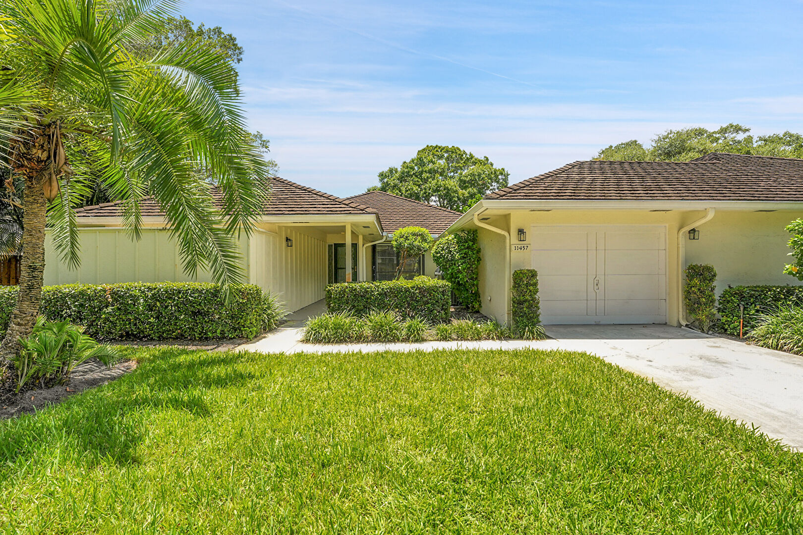 Front at 11457 Sandy Oaks Court, North Palm Beach, FL 33408, listed by Devin Kalvaitis