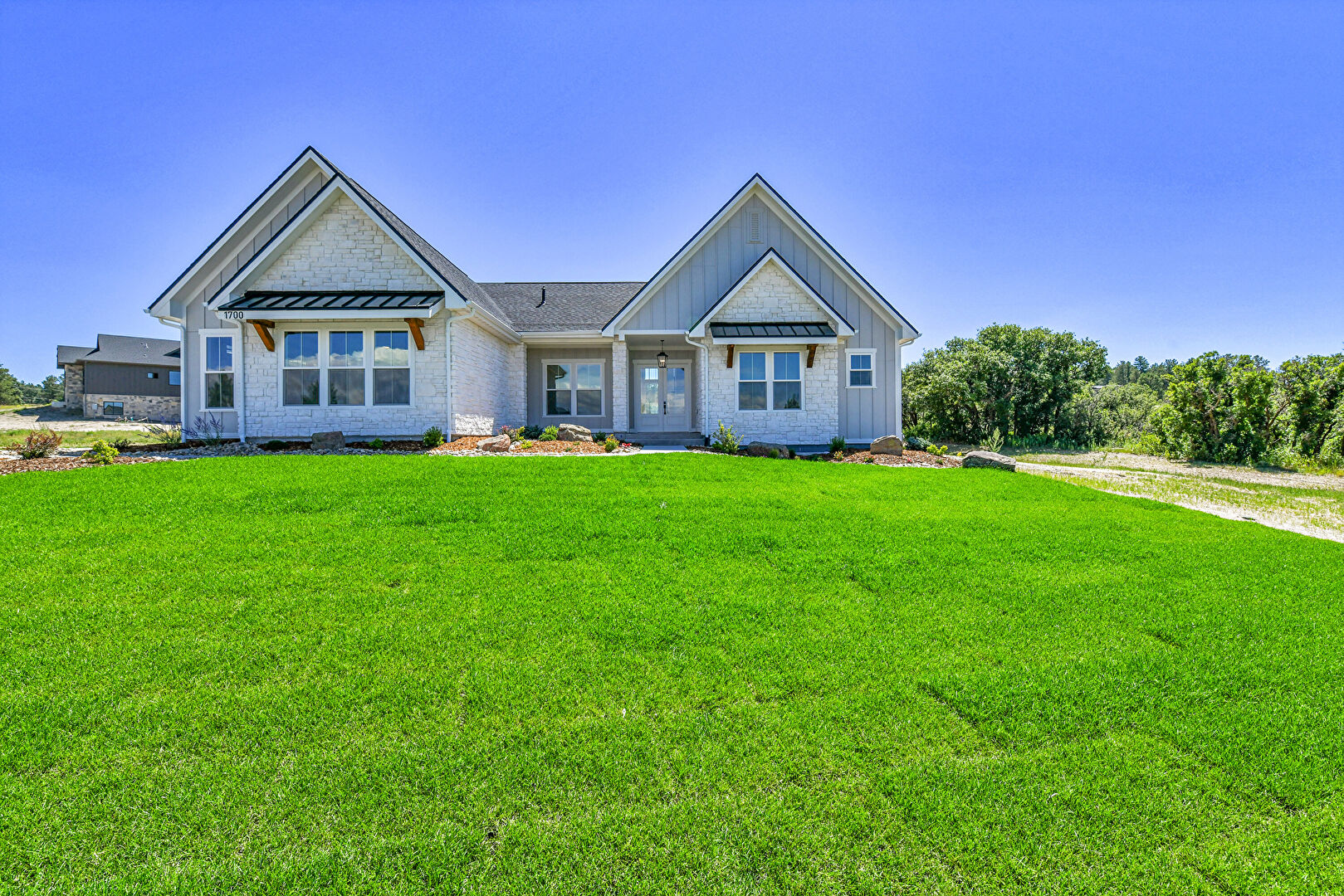 Front at 1700 Arrowpoint Court, Franktown, CO 80116, listed by Megan Gage