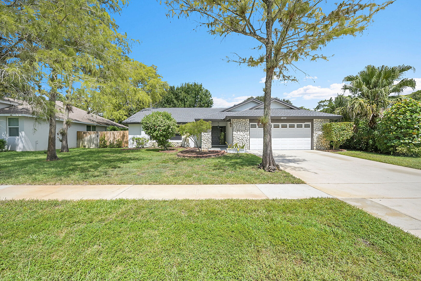 Front yard at 1800 Primrose Lane, Wellington, FL 33414, listed by Ryan Jennings