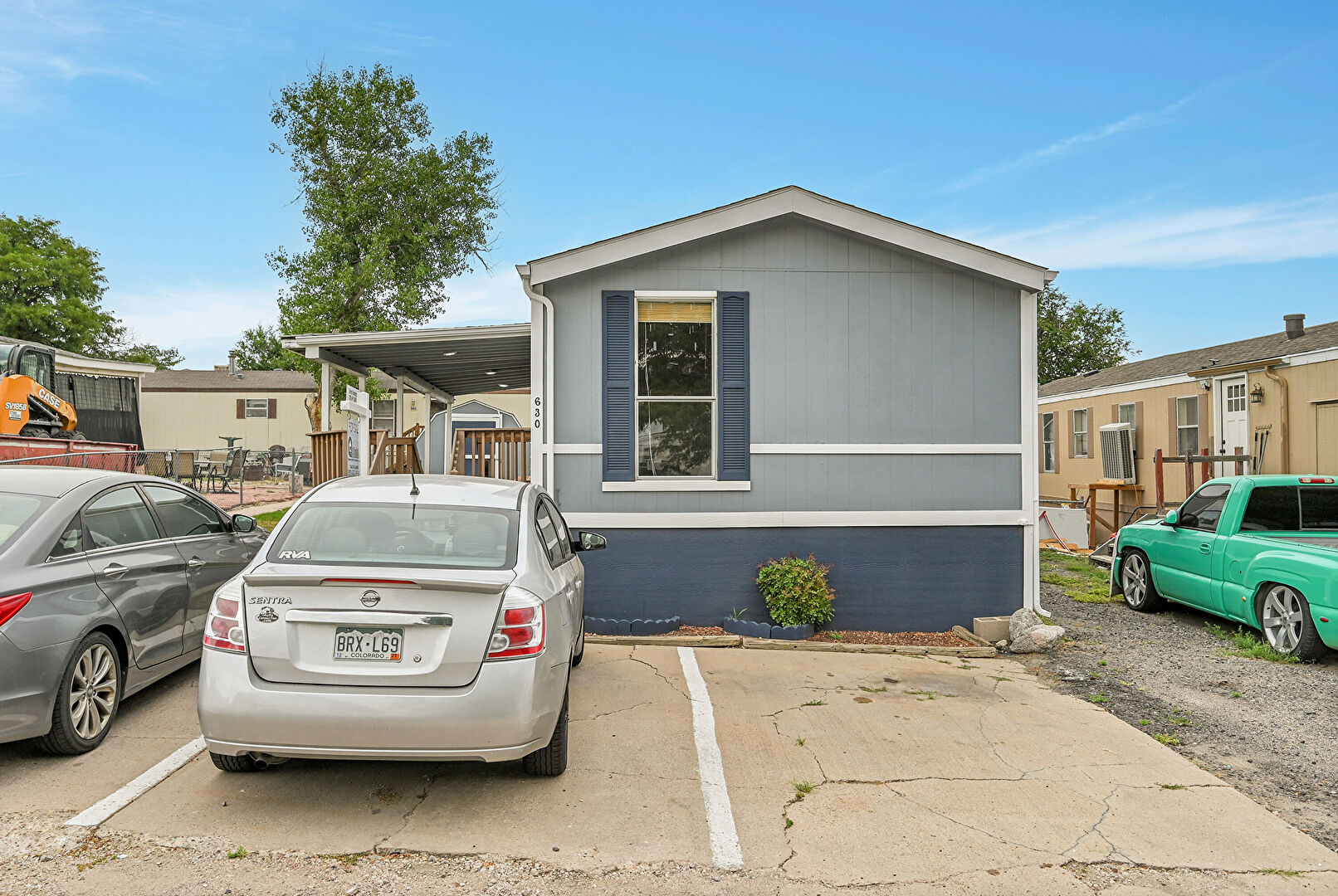 Front at 4210 East 100th Avenue Lot 630, Thornton, CO 80229, listed by Magdalena Tarango