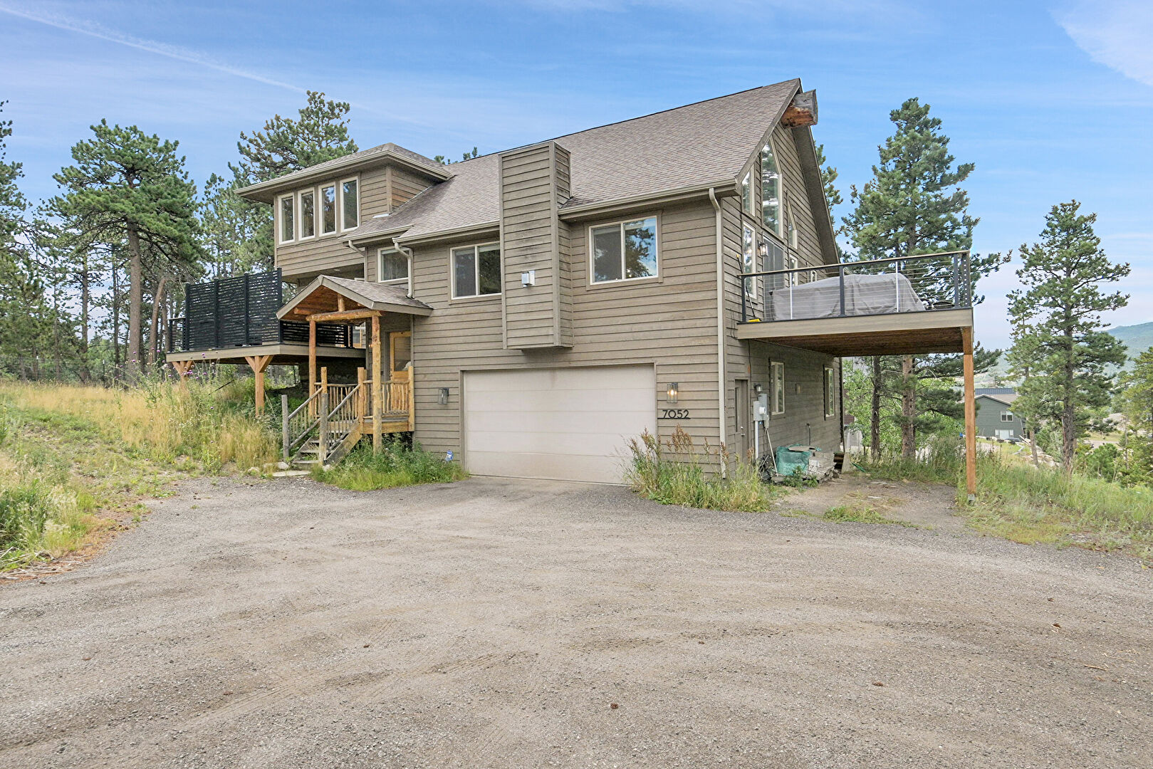 Front at 7052 Lynx Lair Road, Evergreen, CO 80439, listed by Sandra Bosworth