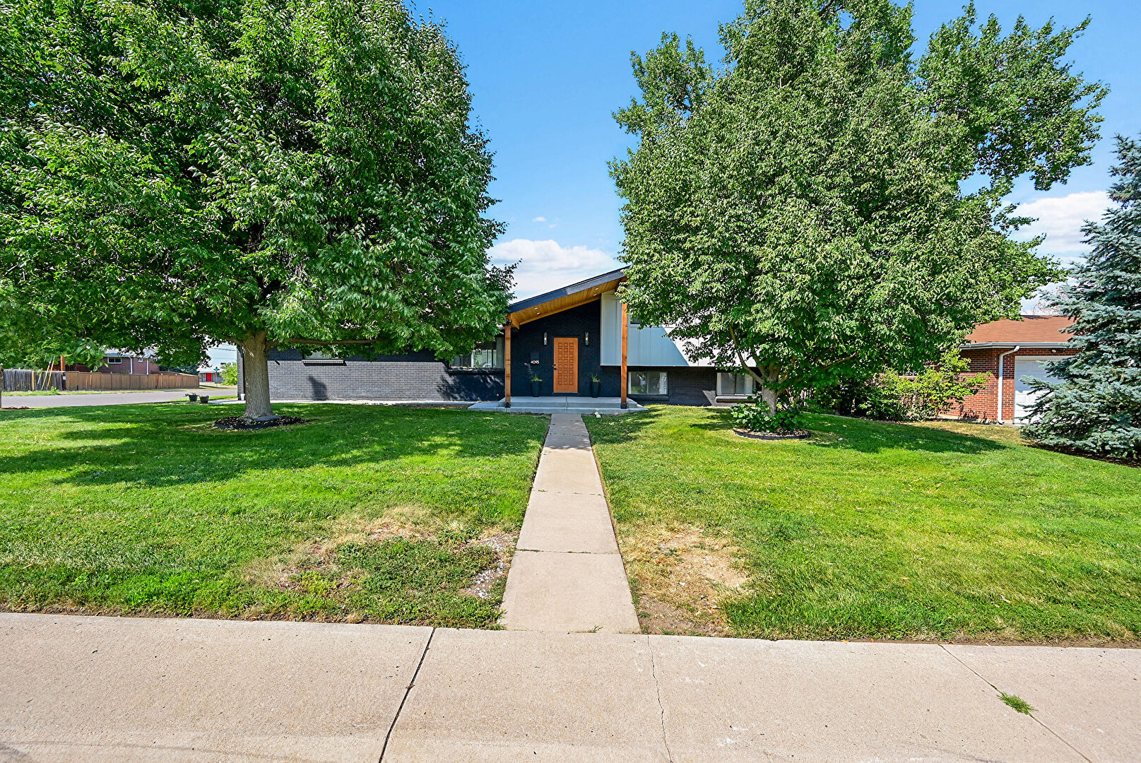Front at 4095 W Radcliff Avenue, Denver, CO 80236, listed by Brandon Dalton