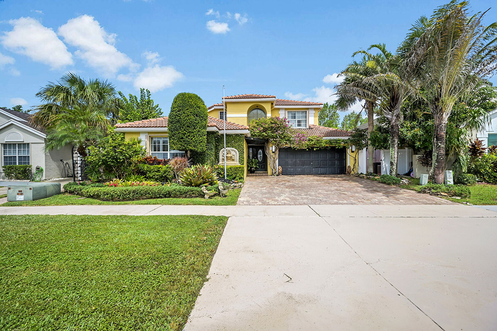 Front yard at 9398 Aegean Drive, Boca Raton, FL 33496, listed by Joey Cardinot