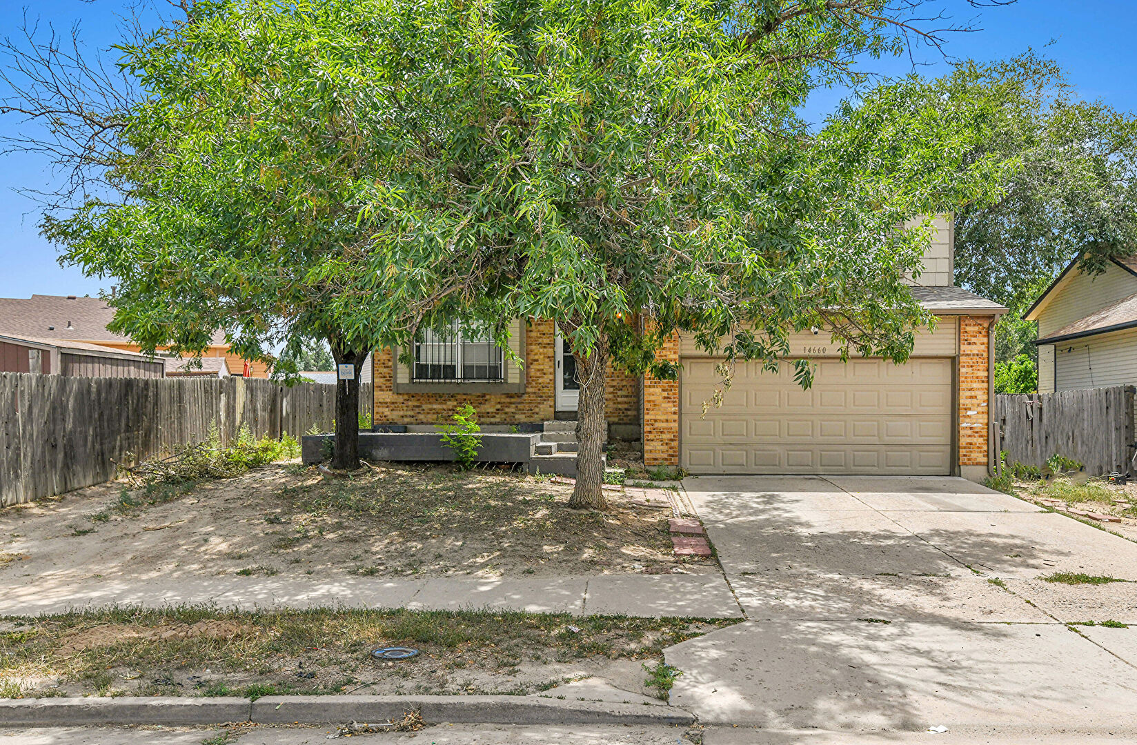 Front at 14660 Bolling Drive, Denver, CO 80239, listed by Justin Bourn