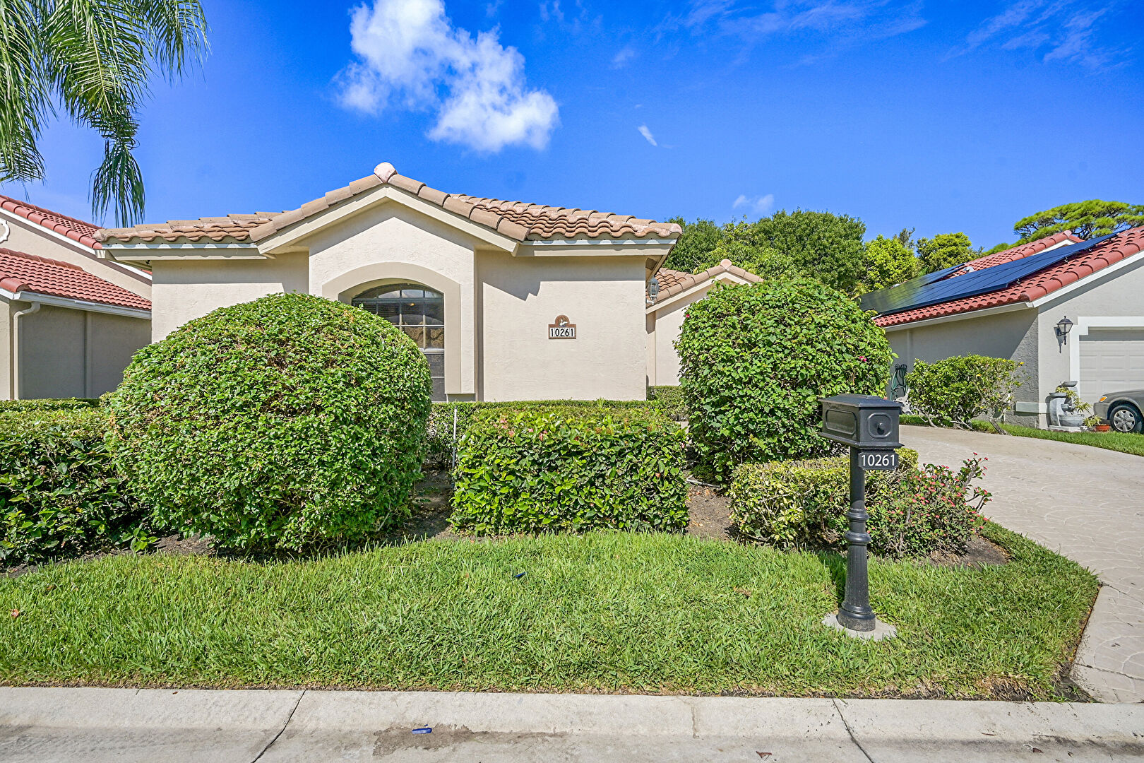 Front yard at 10261 Lexington Lakes Boulevard South, Boynton Beach, FL 33436, listed by Tina Capp