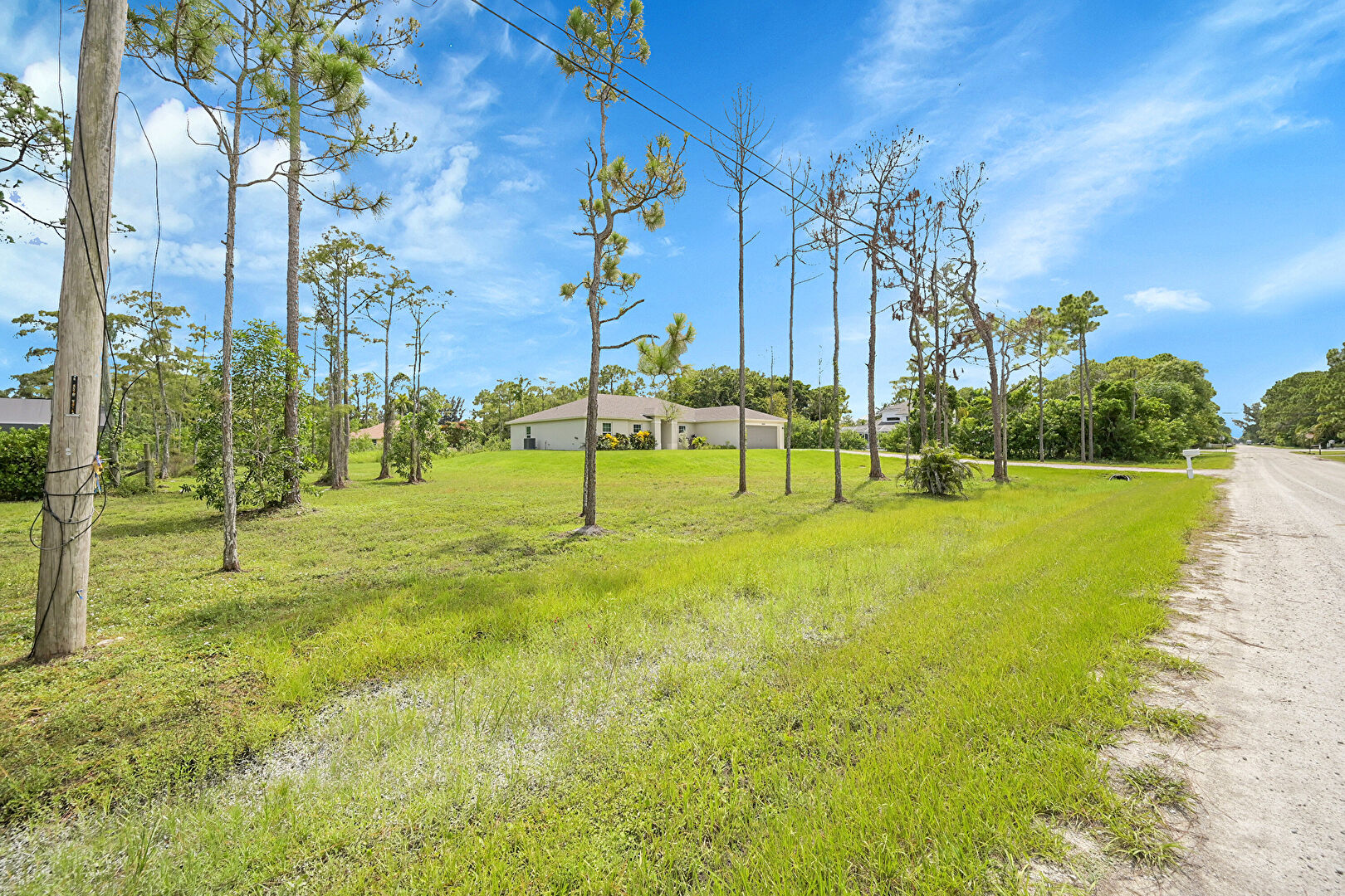 Front yard at 16440 81st Lane, Loxahatchee, FL 33470, listed by Chris Dyer