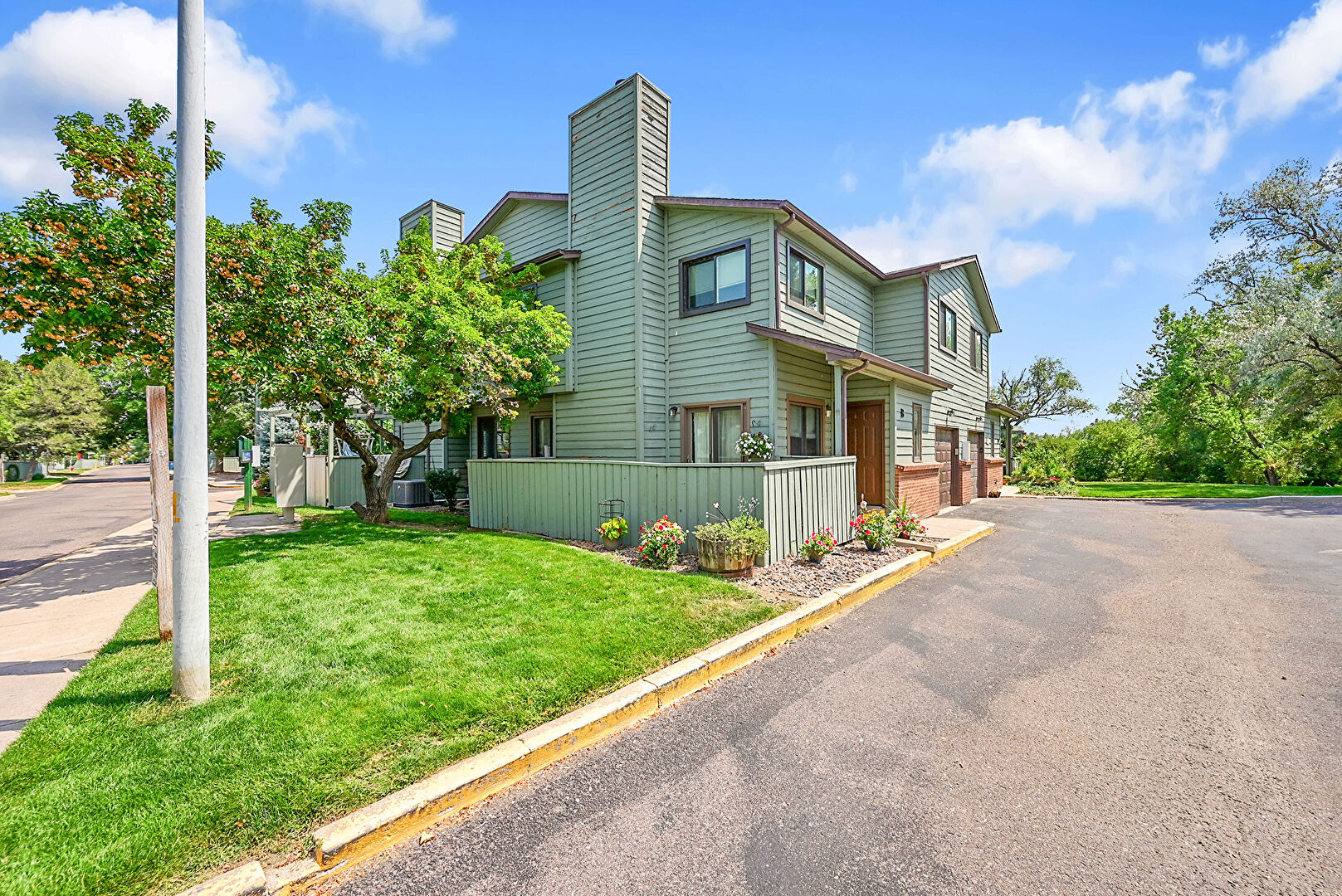 Front at 10430 West Jewell Avenue, unit b, Lakewood, CO 80232, listed by Mike & Ed Hardey