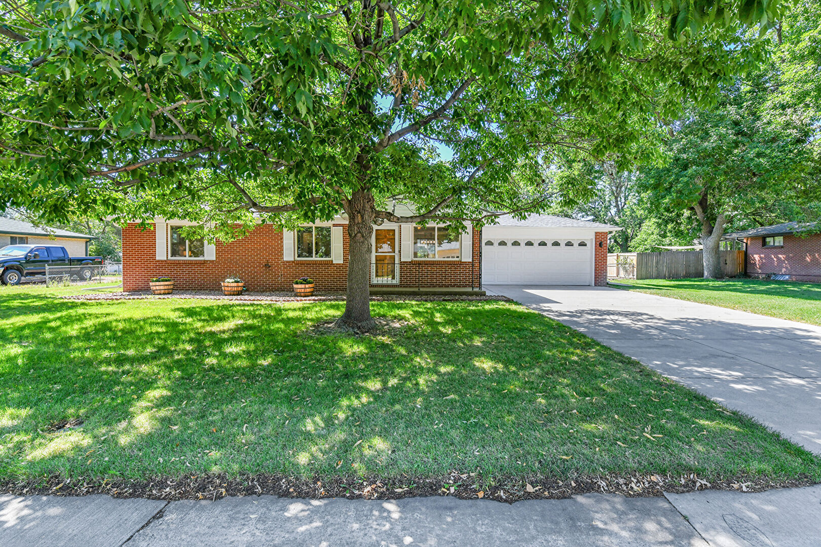 Front at 8420 West 59th Avenue, Arvada, CO 80004, listed by Paul D. Andrews