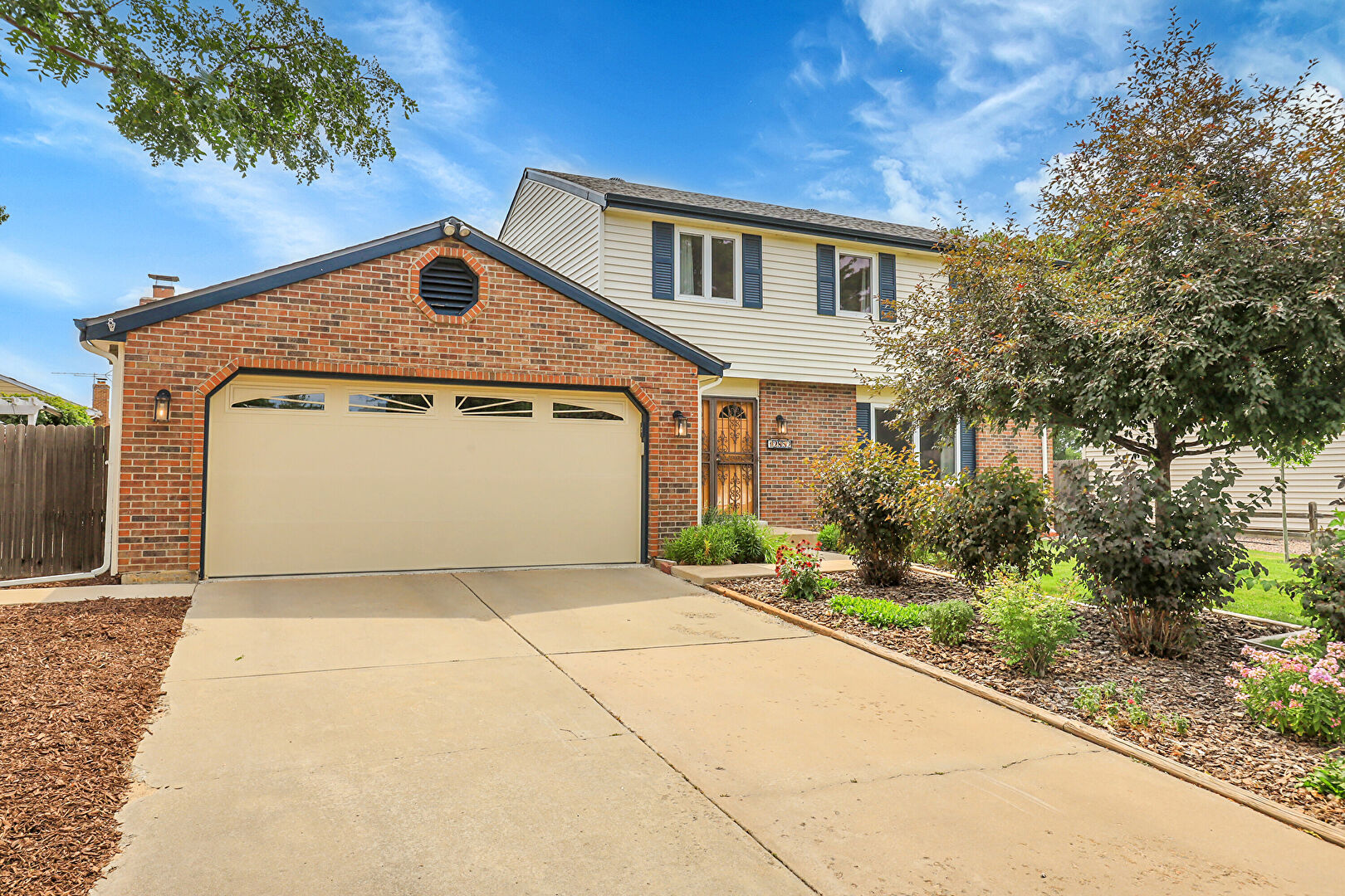 Front at 12852 East Mexico Avenue, Aurora, CO 80012, listed by Mike & Ed Hardey