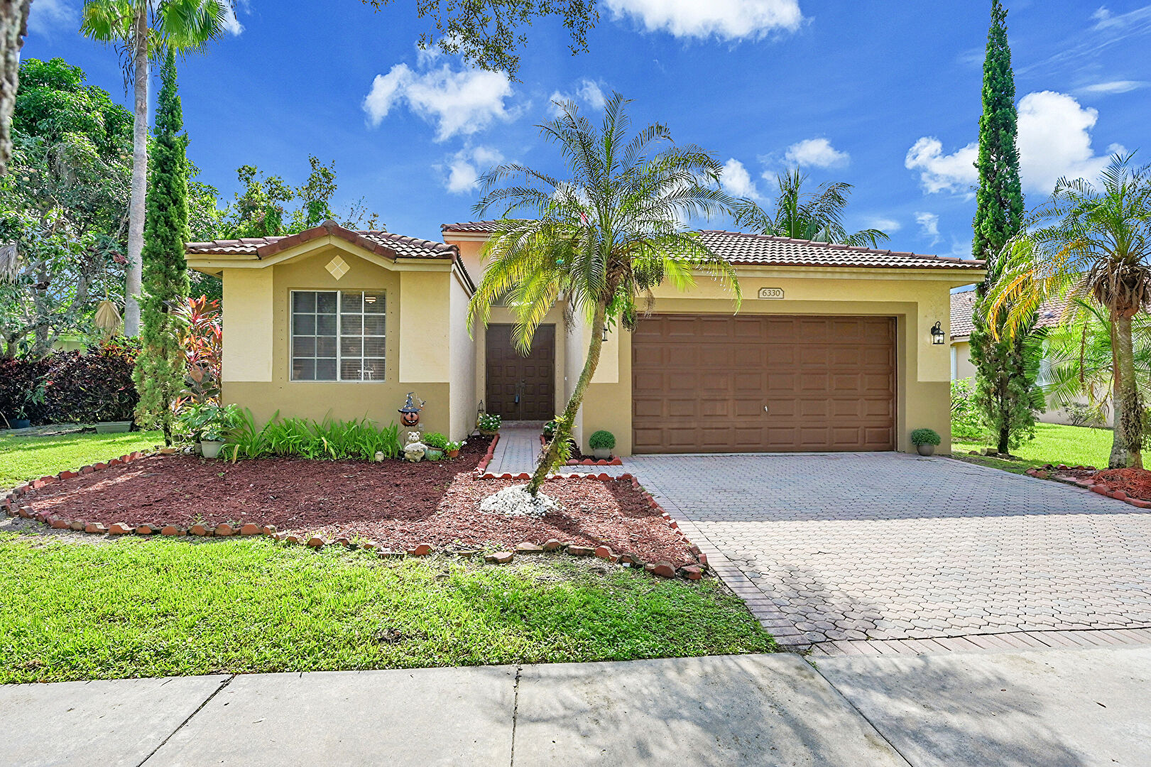 Front at 6330 Osprey Terrace, Coconut Creek, FL 33073, listed by Laura Sanders