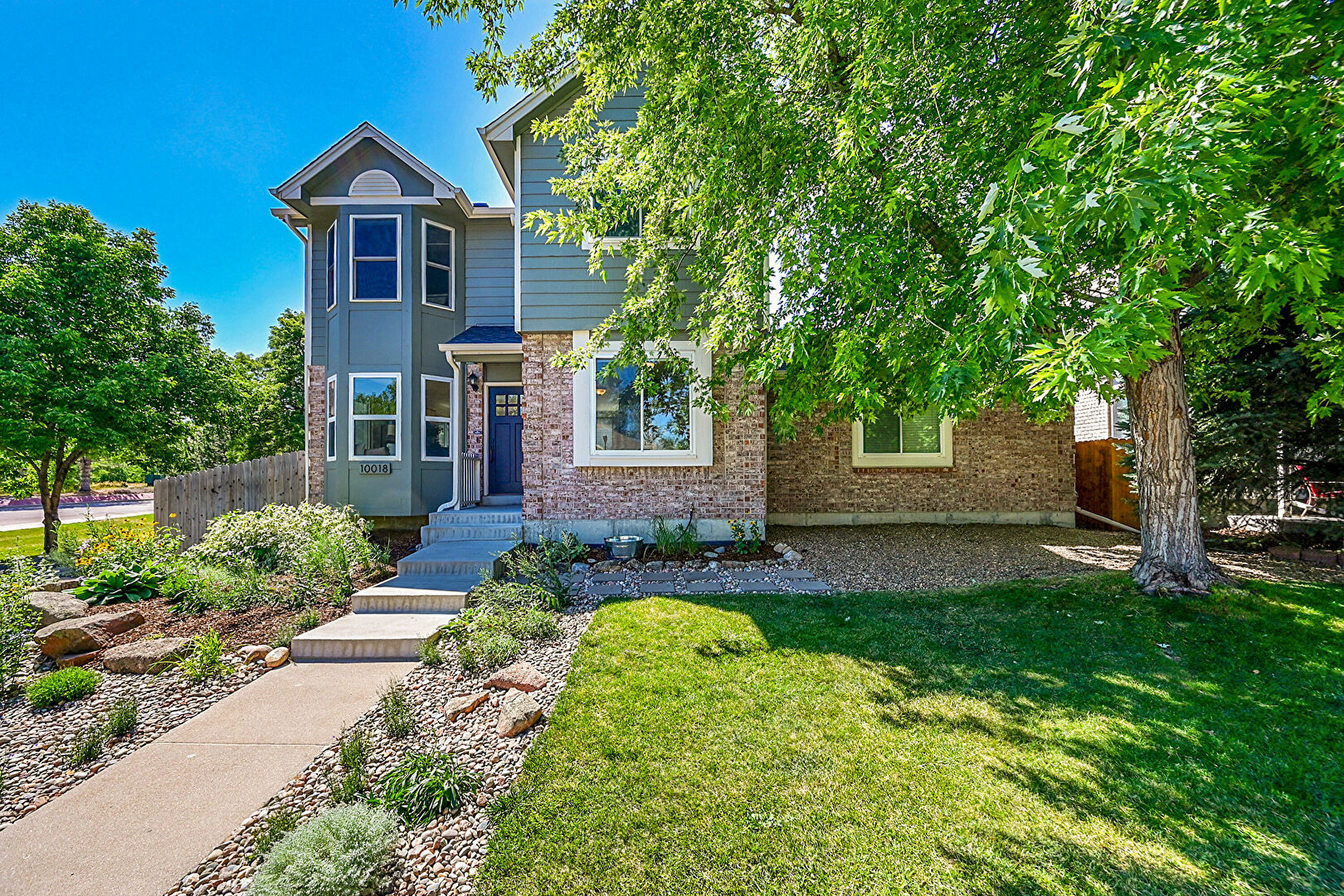 Front at 10018 West 82nd Lane, Arvada, CO 80005, listed by Paul D. Andrews