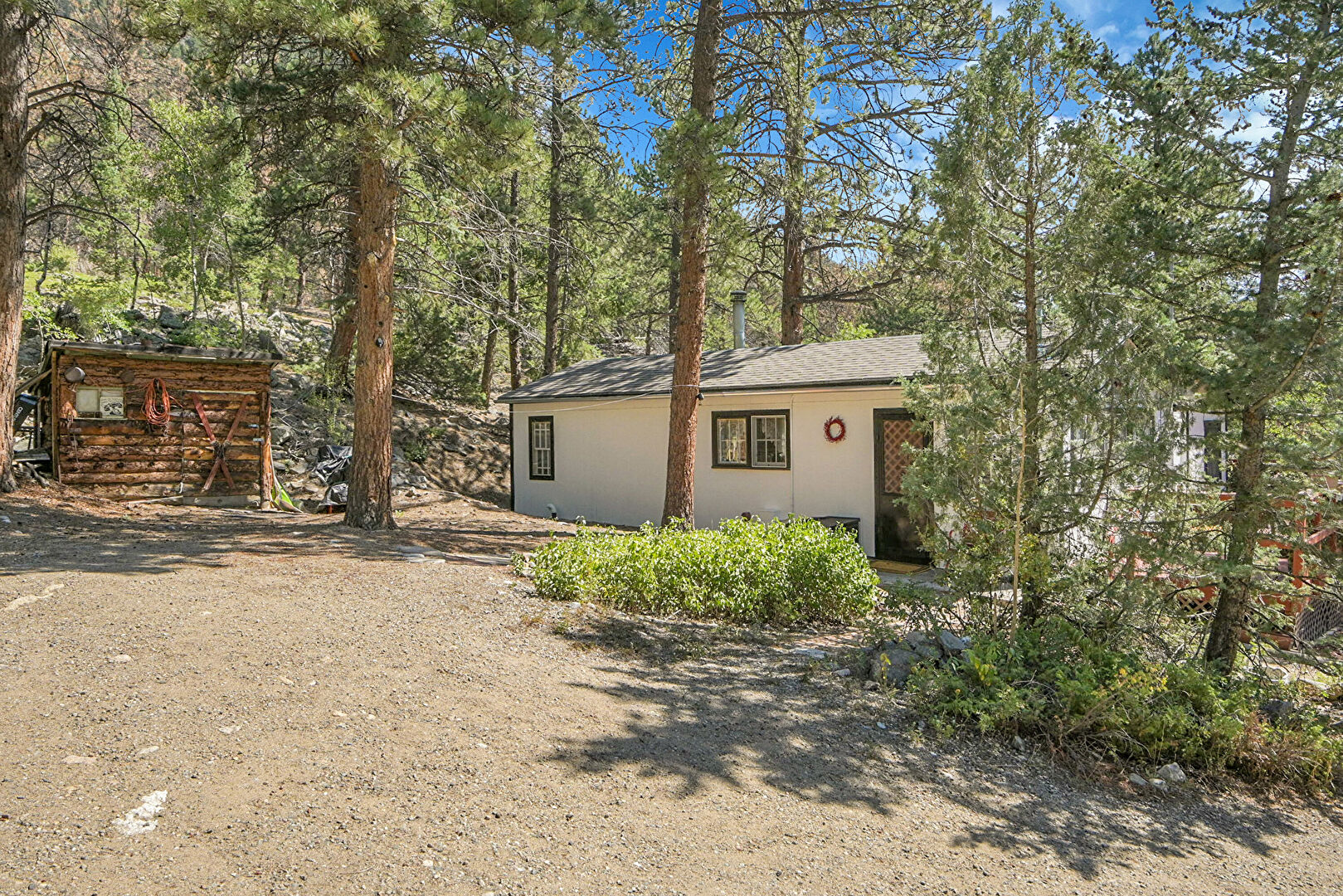 Front at 11659 U.S. 40, Empire, CO 80438, listed by Sandra Bosworth