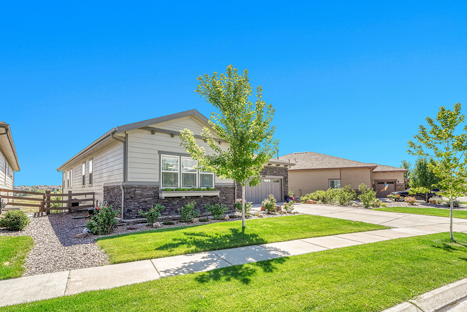 Front at 6470 South Riverwood Court, Aurora, CO 80016, listed by Mike & Ed Hardey