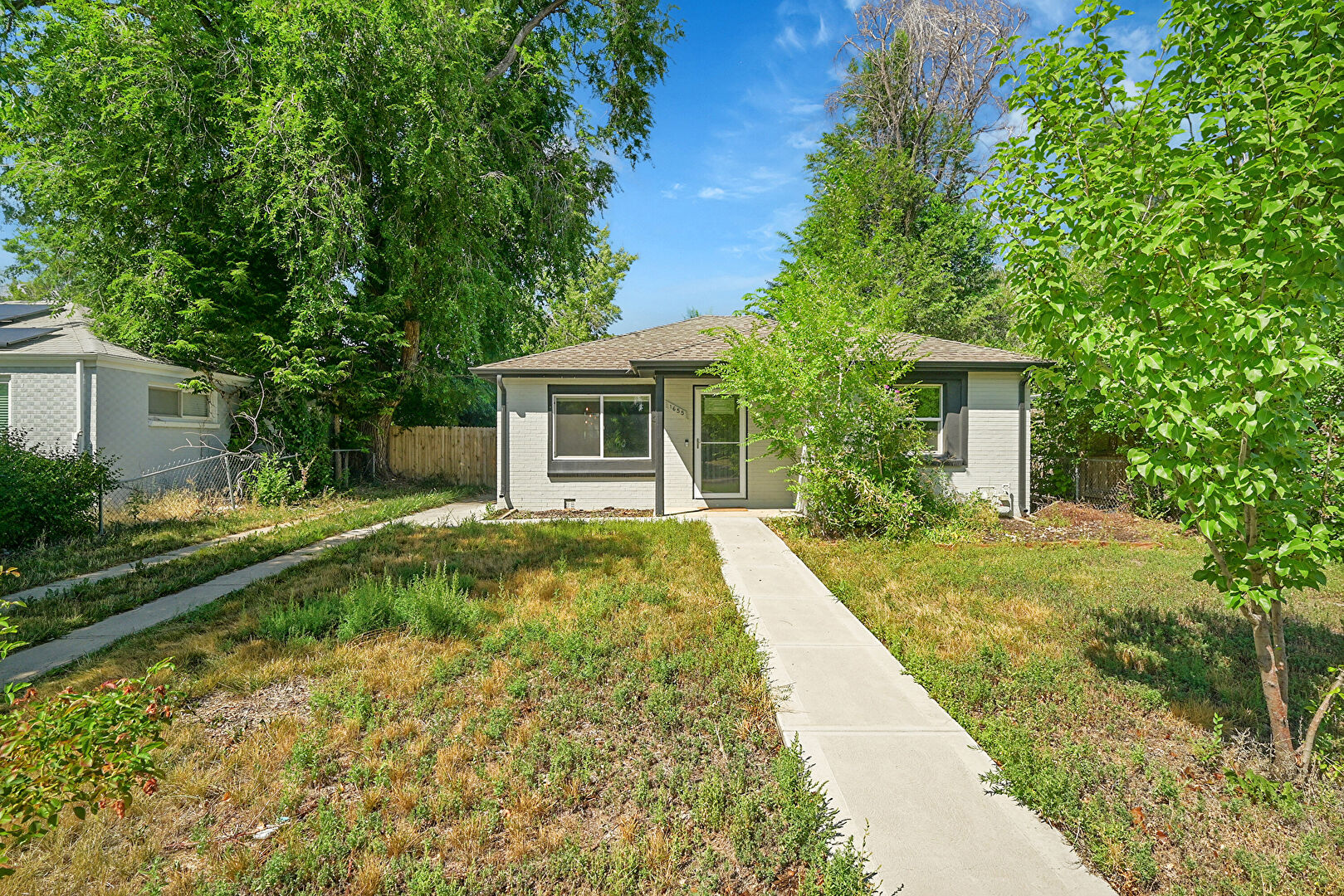 Front at 1655 Yosemite Street, Denver, CO 80220, listed by Taylor Haas