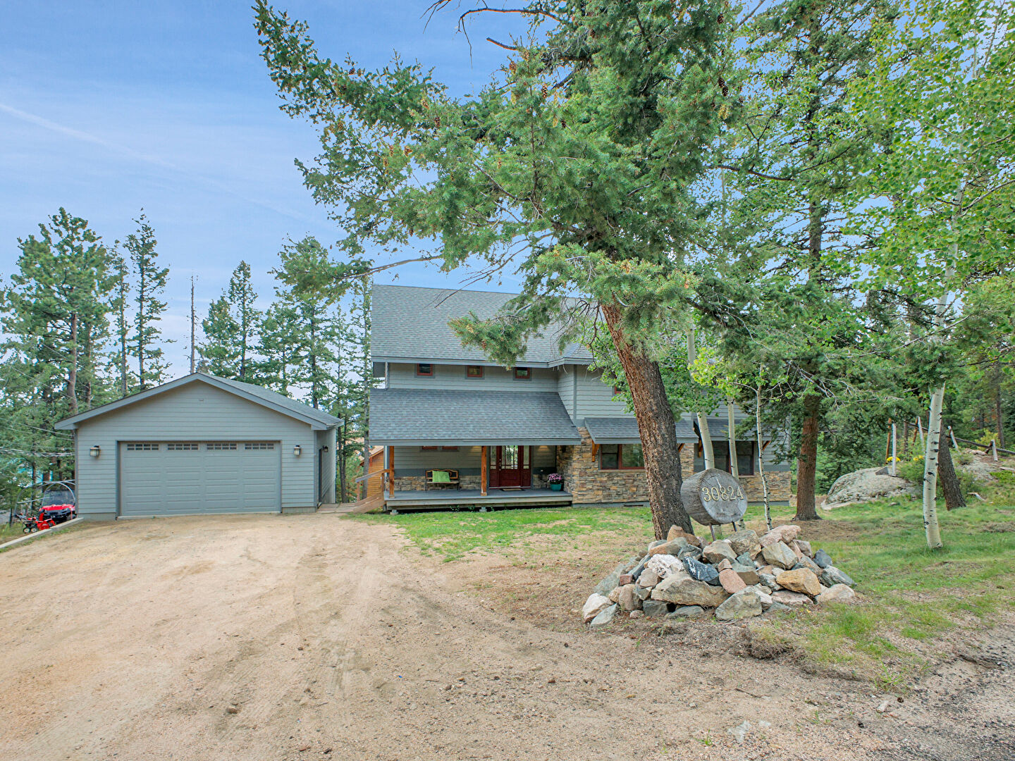 Front at 30824 Kings Valley Drive, Conifer, CO 80433, listed by Pandora & John Erlandson, MLS ID: 3455396