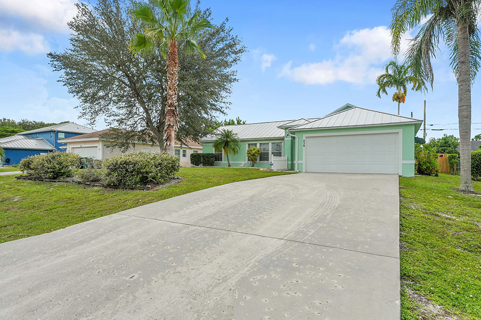Front at 450 Southwest Dauphin Avenue, Port St. Lucie, FL 34953, listed by Manuel (Manny) Rey