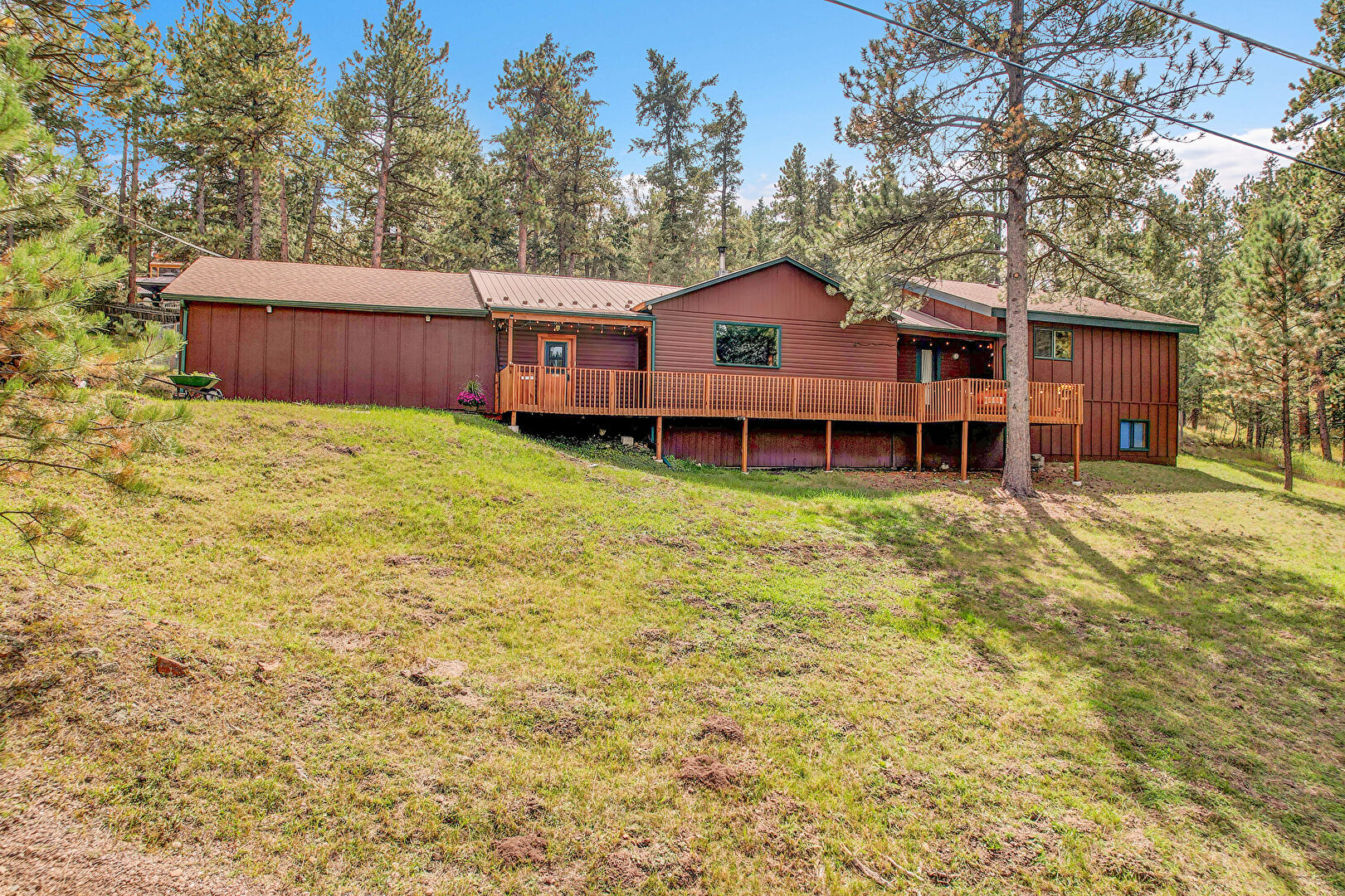 Back at 26978 Mesa Drive, Evergreen, CO 80439, listed by Pandora & John Erlandson, MLS ID: 3319476