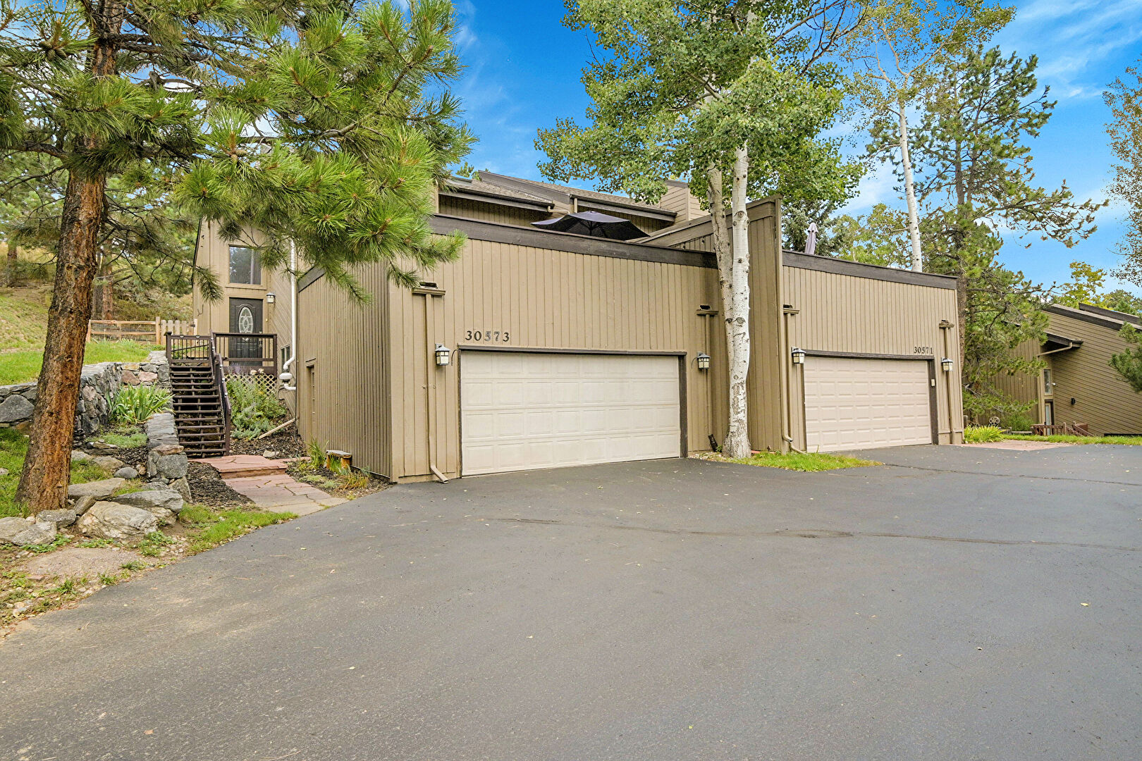 Front at 30573 Sun Creek Drive, Evergreen, CO 80439, listed by Sandra Bosworth