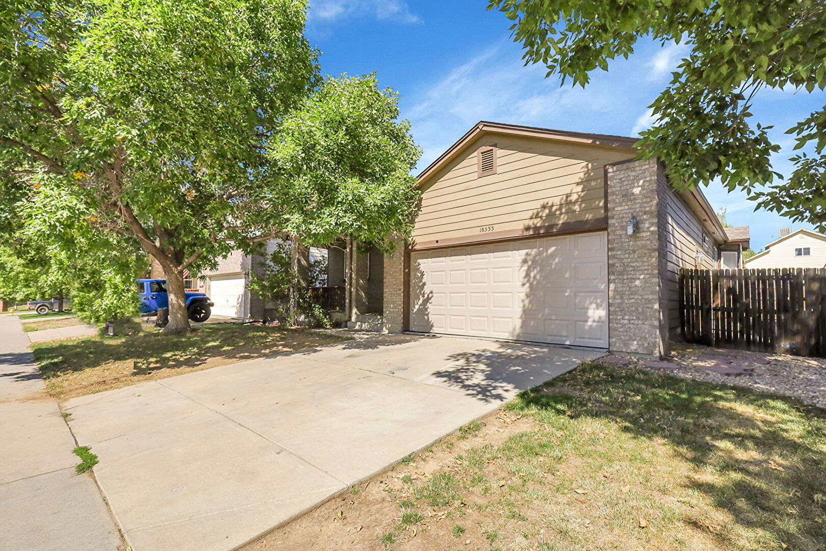 Front at 18533 E Bates Dr, Aurora, CO 80015, listed by Silvia Yanet Ocampo