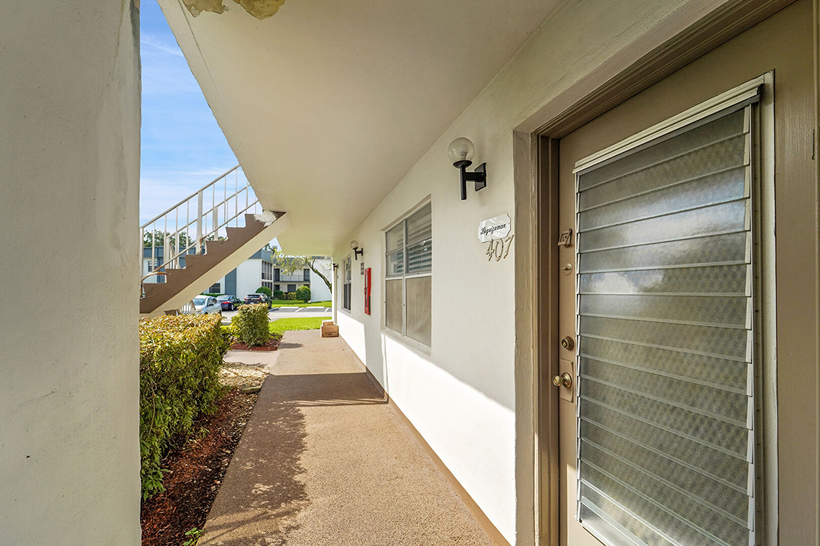 Exterior Entry at 407 Piedmont Park, Delray Beach, FL 33484, listed by Larry Mastropieri