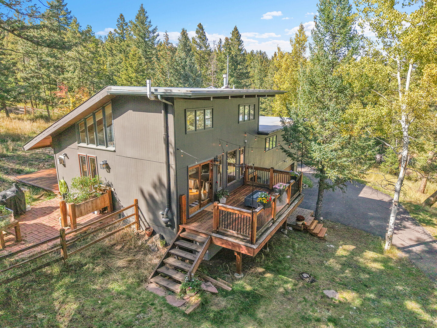 Back at 8077 South Centaur Drive, Evergreen, CO 80439, listed by Jodi Dolph