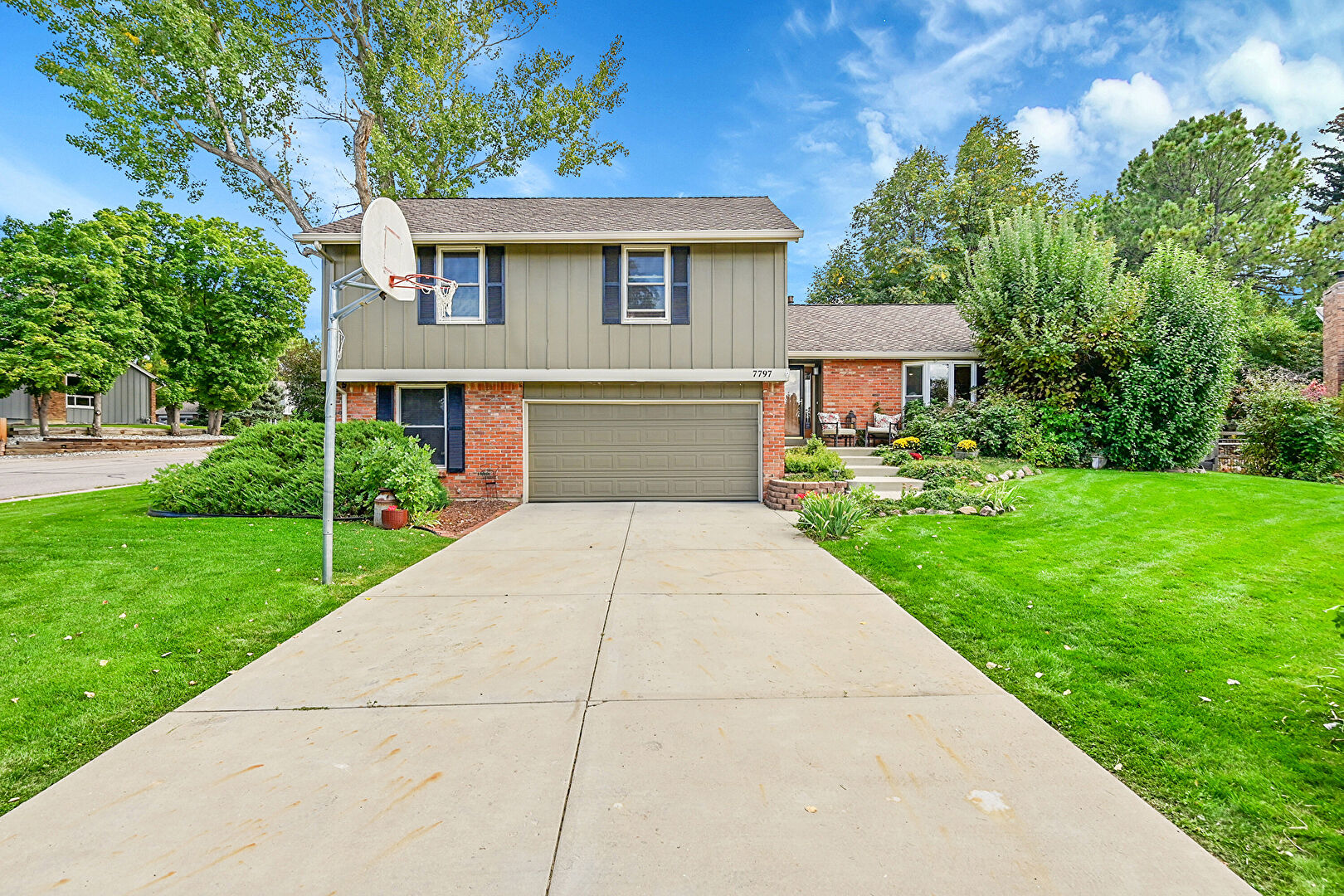 Front at 7797 South Willow Way, Centennial, CO 80112, listed by Greg Dach