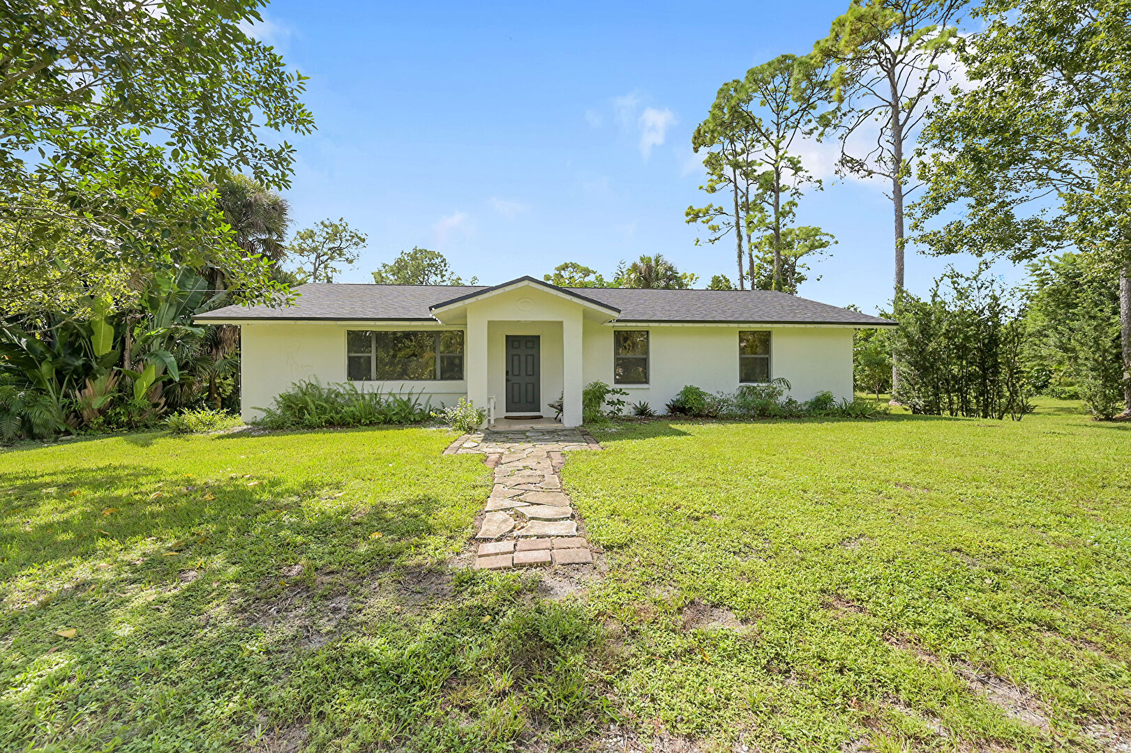 Front yard at 13266 52nd Court North, West Palm Beach, FL 33411, listed by Rafael Carrero