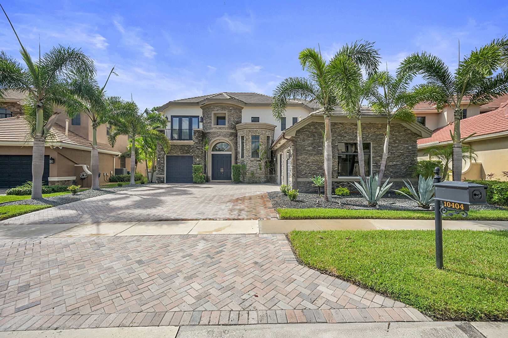 Front at 10404 Trianon Place, Wellington, FL 33449, listed by Ravi Mohanka