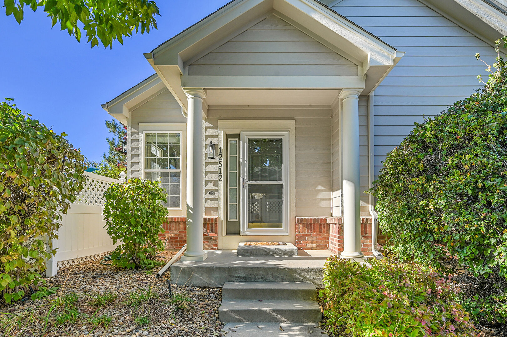 Exterior Entry at 12512 East Harvard Circle, Aurora, CO 80014, listed by Jeff Tooker, MLS ID: 2900797
