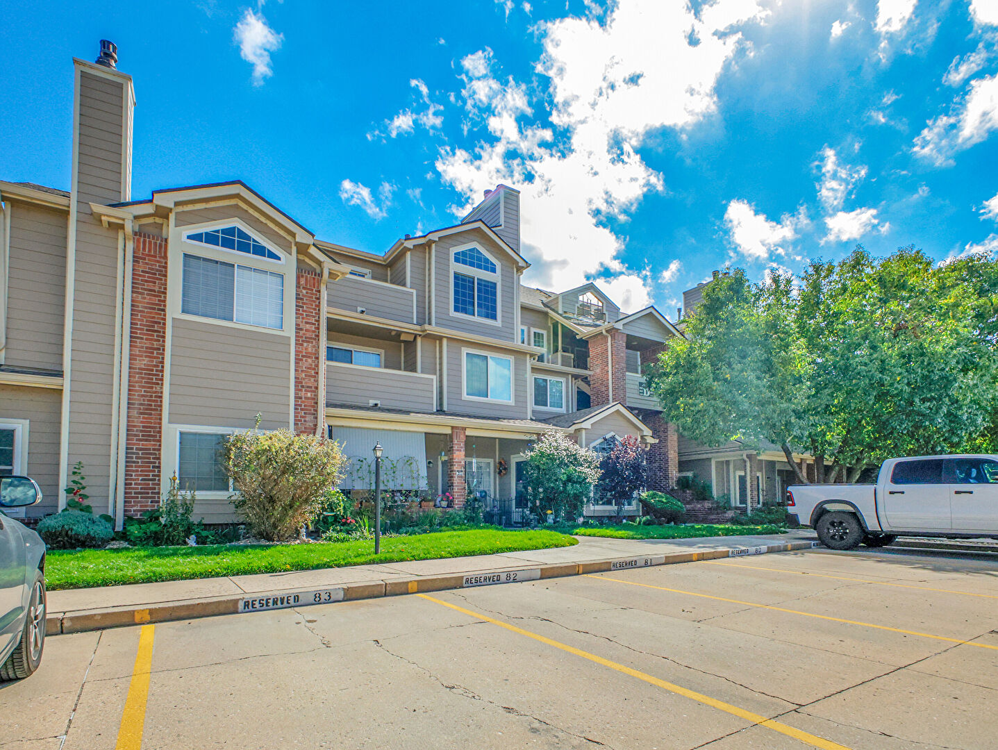Front at 4760 South Wadsworth Boulevard, Unit D203, Littleton, CO 80123, listed by Sandra Bosworth