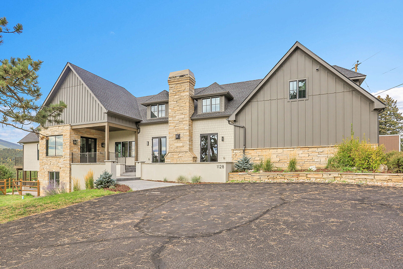 Front at 1128 County Road 65, Evergreen, CO 80439, listed by Pandora & John Erlandson