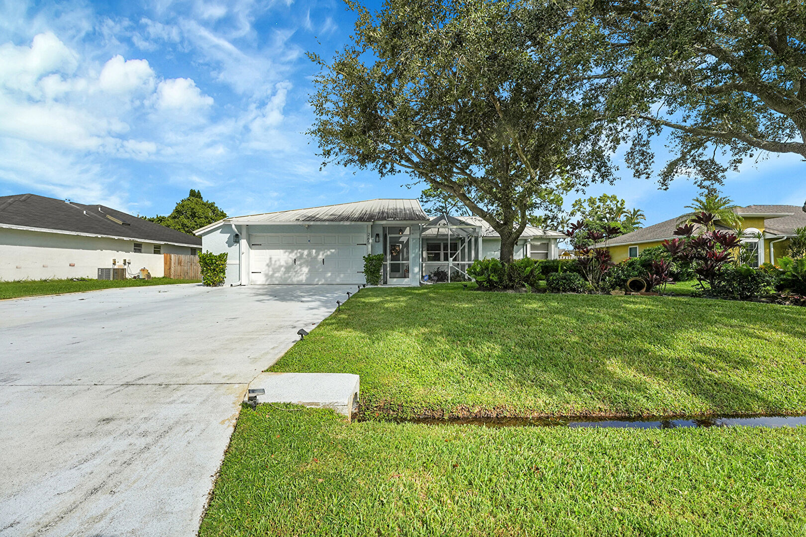 Front at 265 Southeast Todd Avenue, Port St. Lucie, FL 34983, listed by Teresita Amado