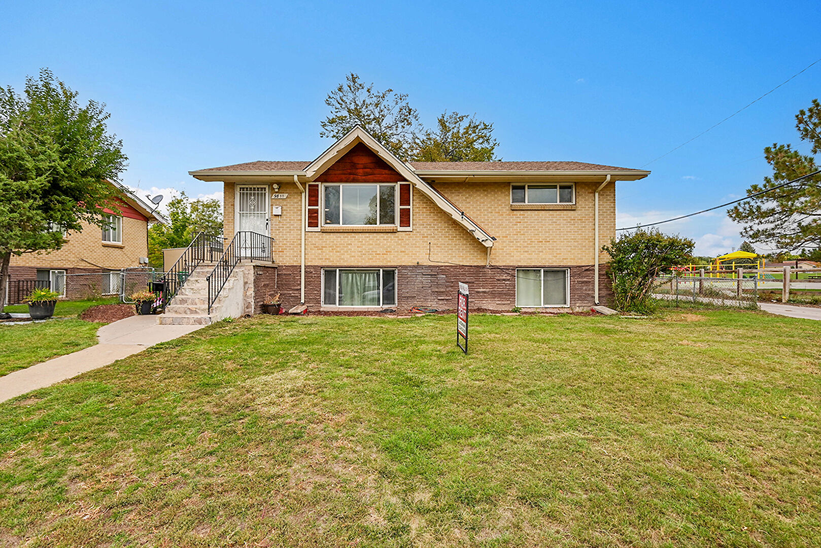 Front at 9811 Lowry Place, Aurora, CO 80010, listed by Luz Daniels