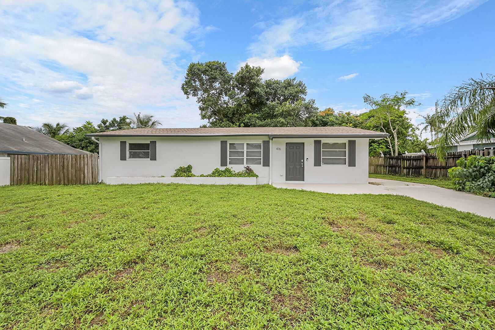 Front yard at 416 Southwest 7th Court, Boynton Beach, FL 33435, listed by Ravi Mohanka