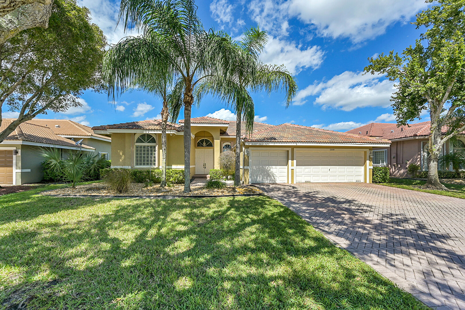 Front at 12459 Northwest 52nd Court, Coral Springs, FL 33076, listed by Laura Sanders, MLS ID: F10502547