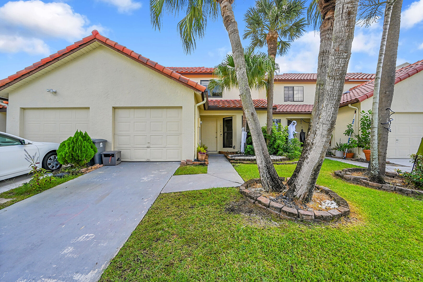 Front at 18578 Woodstream Drive, Boca Raton, FL 33498, listed by Sonia Conserva