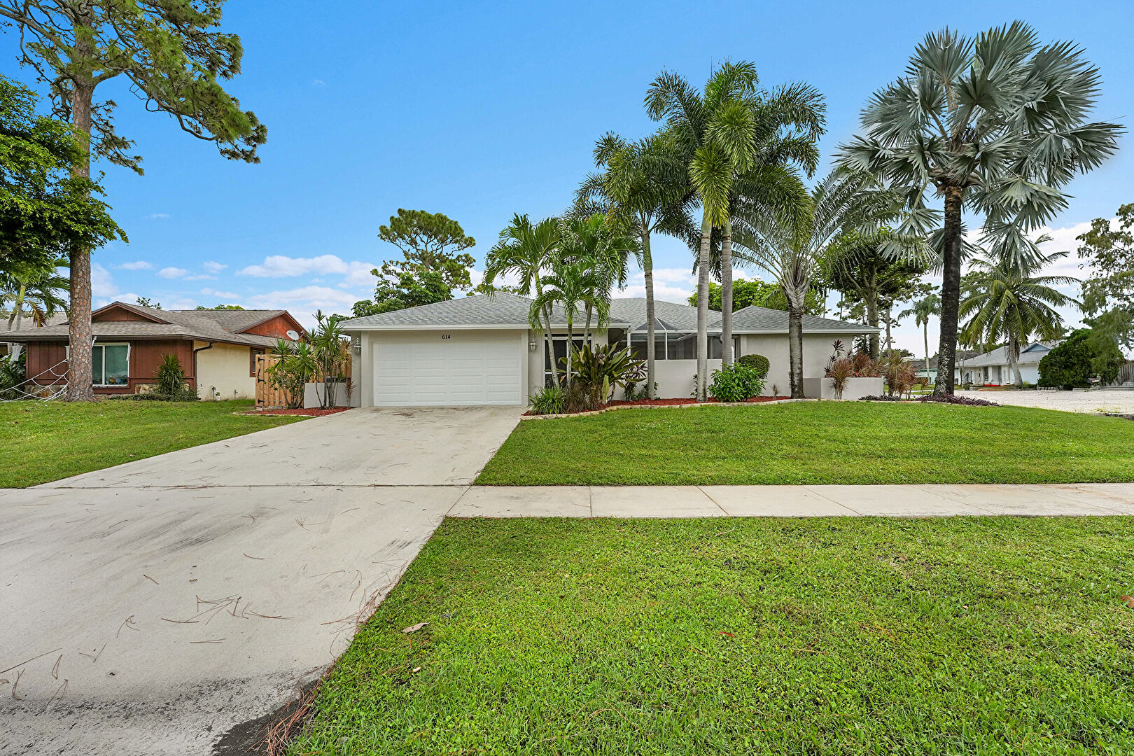 Front at 614 Azure Avenue, Wellington, FL 33414, listed by Becky Urbina