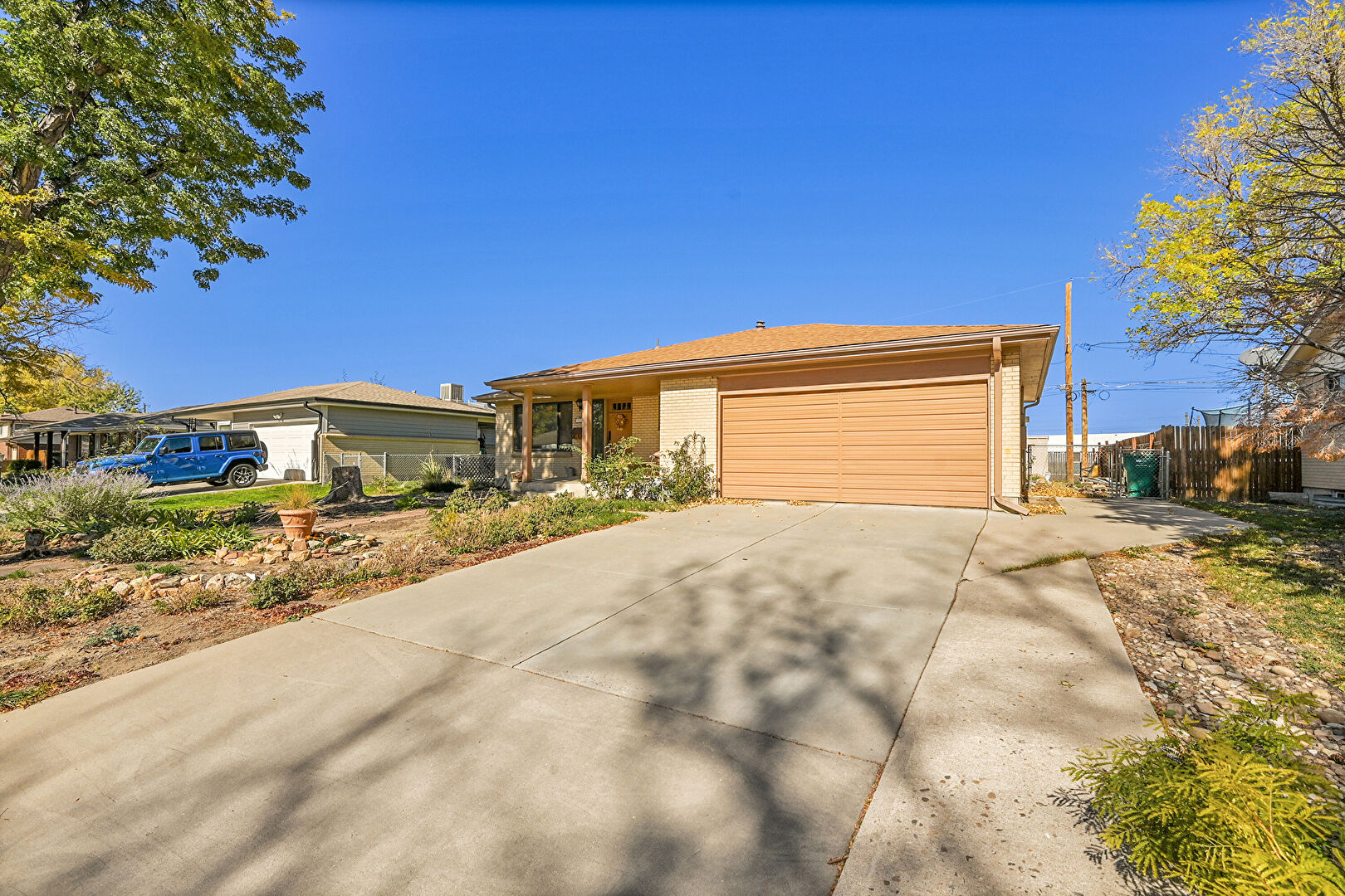 Front at 14163 East 32nd Place, Aurora, CO 80011, listed by Mike & Ed Hardey