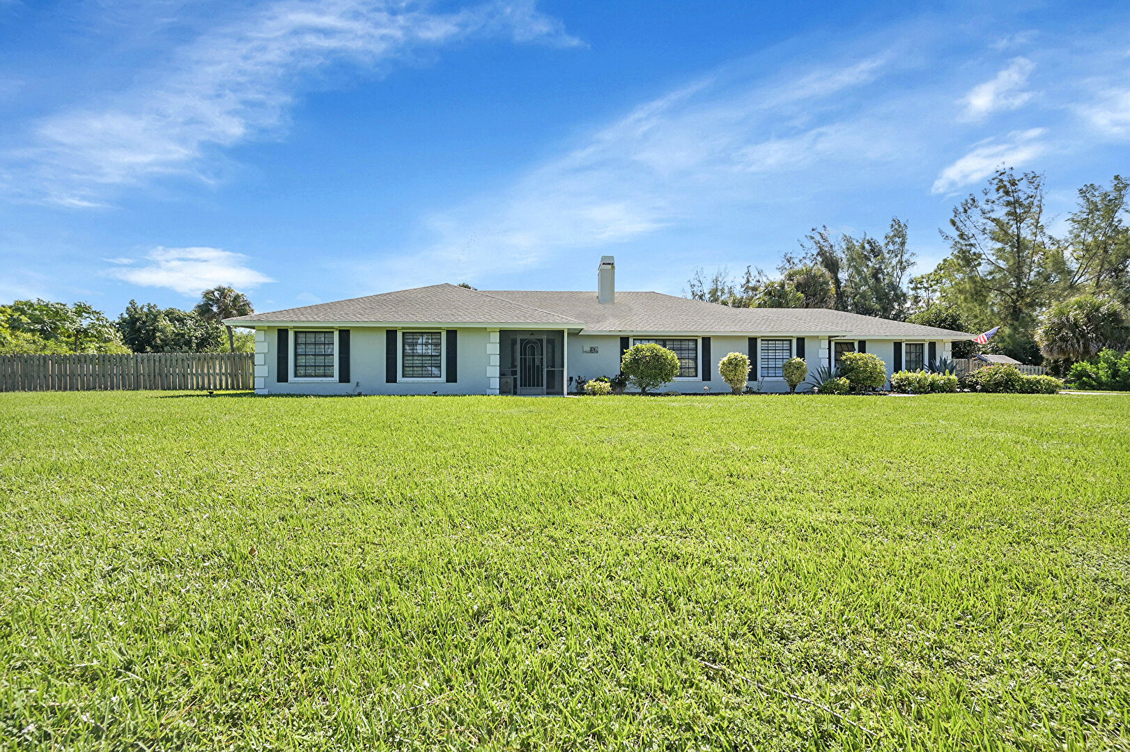 Front yard at 8606 Arrowhead Drive, Lake Worth, FL 33467, listed by Amy Drinnon